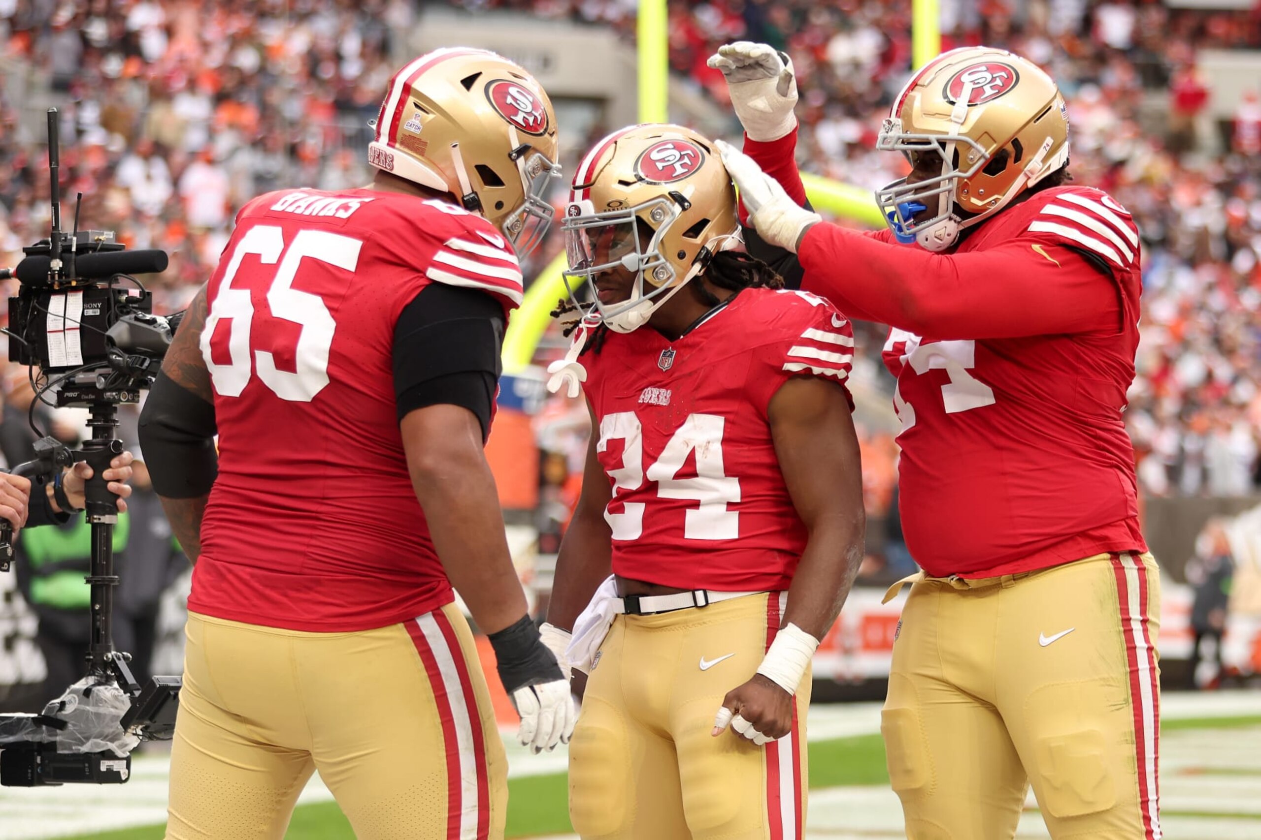 CLEVELAND, OHIO - OCTOBER 15: Jordan Mason #24 of the San Francisco 49ers celebrates with teammates after his fourth quarter touchdown against the Cleveland Browns at Cleveland Browns Stadium on October 15, 2023 in Cleveland, Ohio. (Photo by Gregory Shamus/Getty Images)