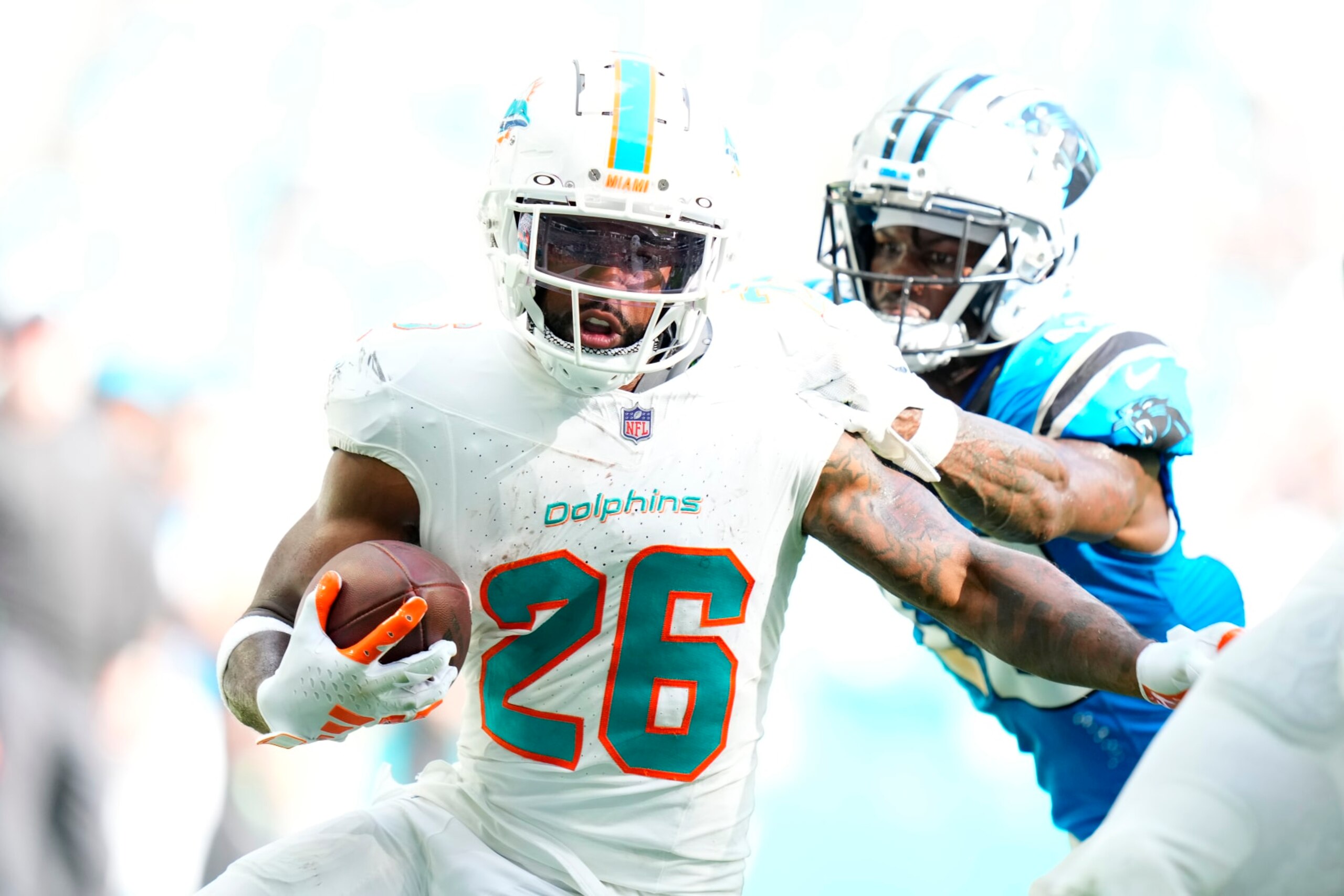 MIAMI GARDENS, FLORIDA - OCTOBER 15: Salvon Ahmed #26 of the Miami Dolphins runs the ball for a touchdown during the fourth quarter in the game against the Carolina Panthers at Hard Rock Stadium on October 15, 2023 in Miami Gardens, Florida. (Photo by Rich Storry/Getty Images)