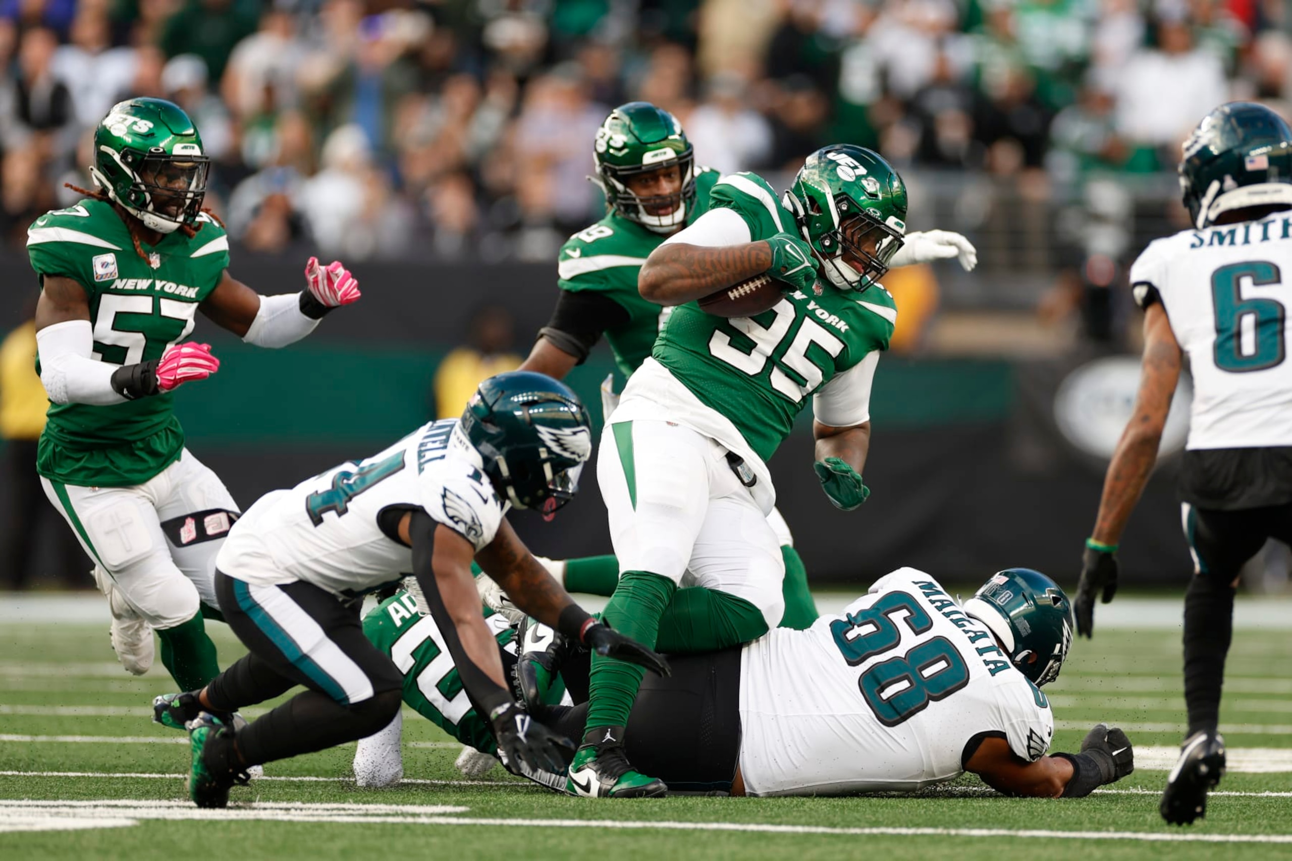 Jets DL Quinnen Williams secures an interception. 