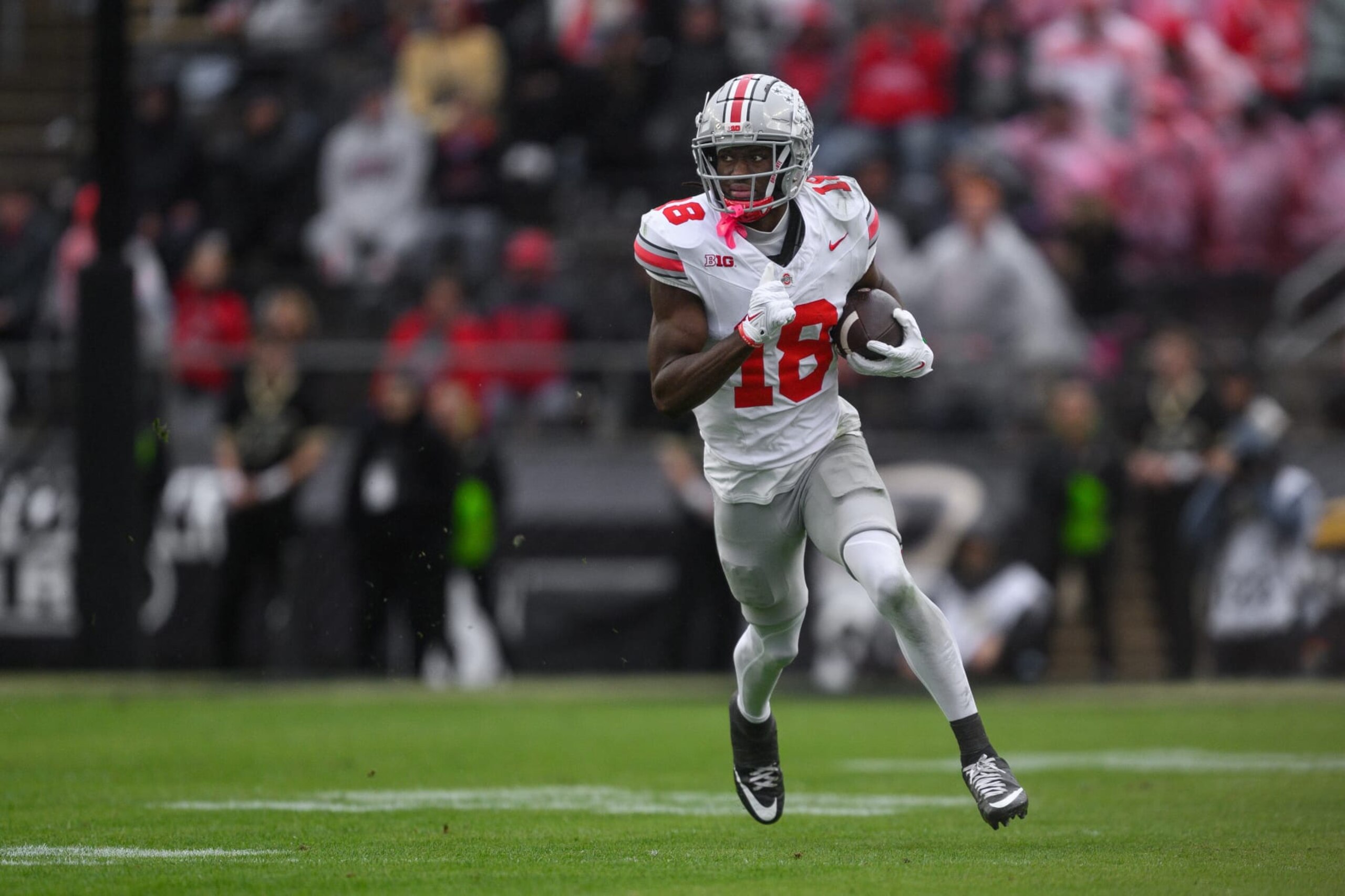 WEST LAFAYETTE, IN - OCTOBER 14: Ohio State Buckeyes wide receiver Marvin Harrison Jr. (18) runs down the field after a catch during the college football game between the Purdue Boilermakers and Ohio State Buckeyes on October 14, 2023, at Ross-Ade Stadium in West Lafayette, IN. (Photo by Zach Bolinger/Icon Sportswire via Getty Images)