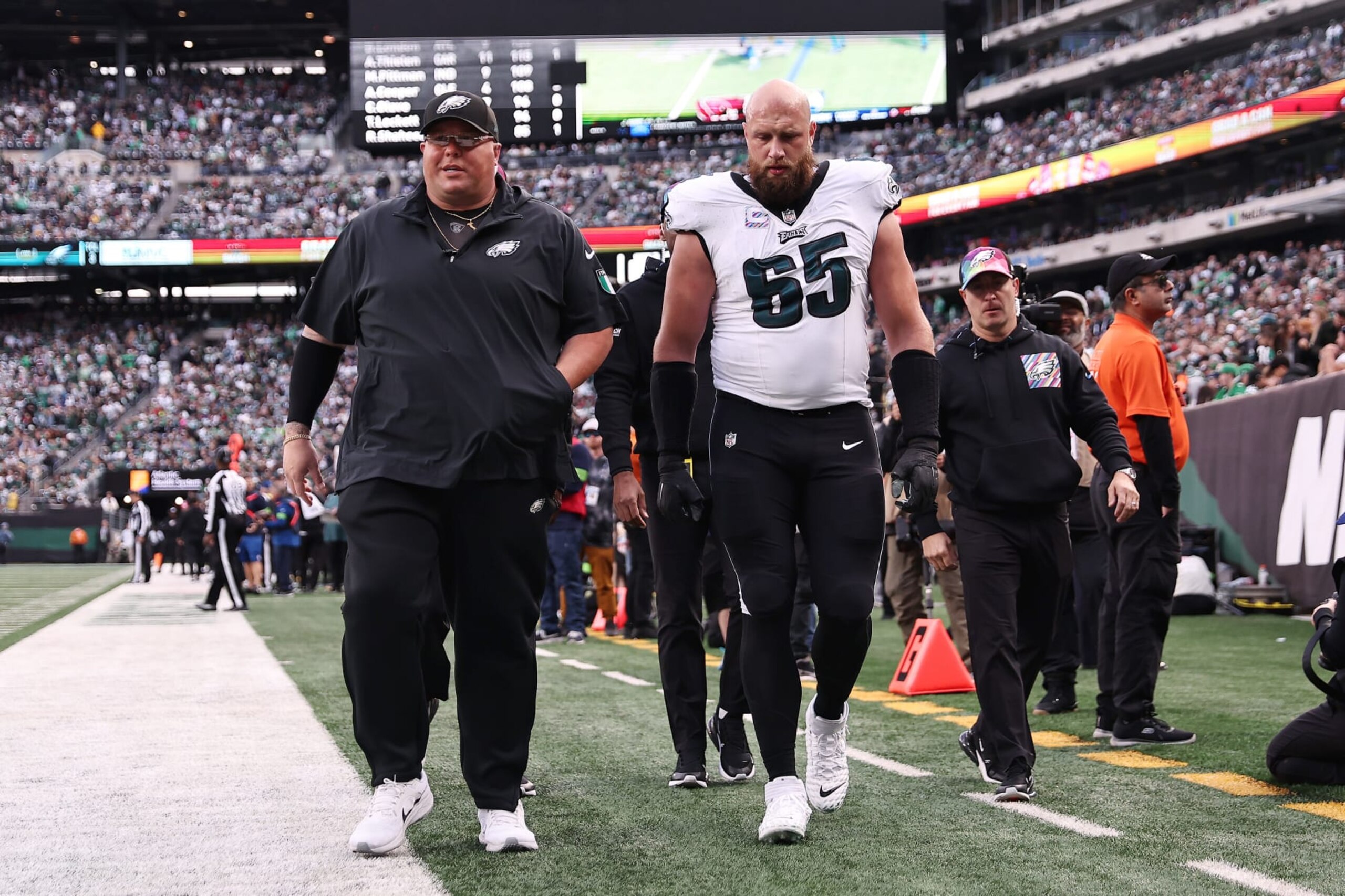 EAST RUTHERFORD, NEW JERSEY - OCTOBER 15: Lane Johnson #65 of the Philadelphia Eagles leaves the game after suffering an injury during the first half against the New York Jets at MetLife Stadium on October 15, 2023 in East Rutherford, New Jersey. (Photo by Dustin Satloff/Getty Images)