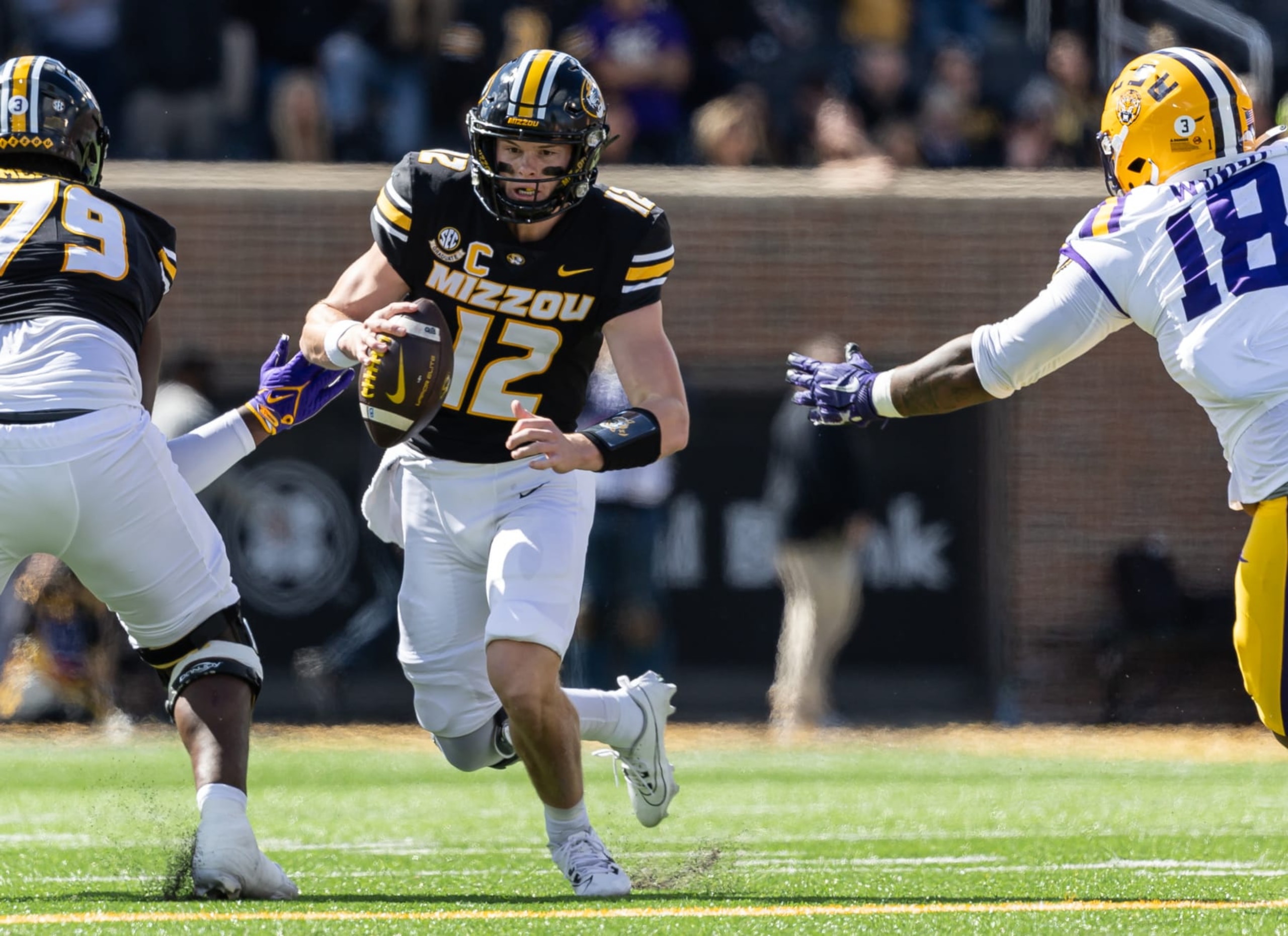 COLUMBIA, MISSOURI - OCTOBER 7: Brady Cook #12 of the Missouri Tigers runs the ball during the game against the LSU Tigers at Faurot Field/Memorial Stadium on October 7, 2023 in Columbia, Missouri. (Photo by Michael Hickey/Getty Images)