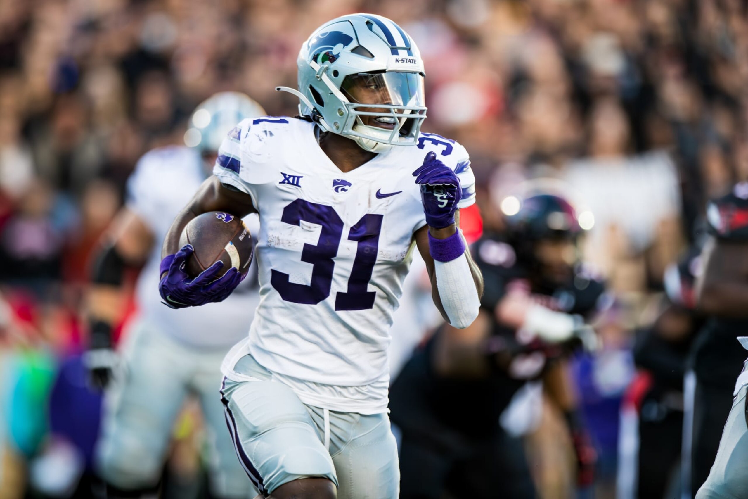 LUBBOCK, TEXAS - OCTOBER 14: DJ Giddens #31 of the Kansas State Wildcats runs the ball during the first half of the game against the Texas Tech Red Raiders at Jones AT&T Stadium on October 14, 2023 in Lubbock, Texas. (Photo by John E. Moore III/Getty Images)