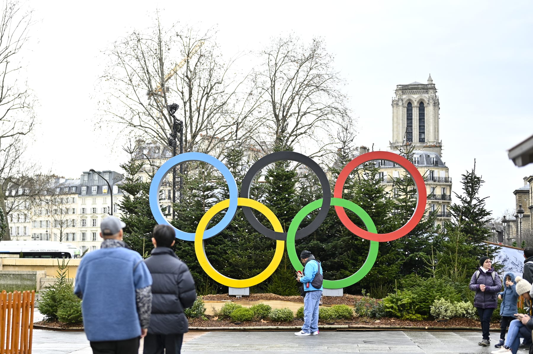 PARIS, FRANCE - DECEMBER 25:  The logo for the Paris 2024 Summer Olympic and Paralympic Games in the Christmas village is shown in front of the Hotel de Ville on December 25, 2022 in Paris, France. Cities around France shine less brightly this Christmas season as local authorities simplify festive decorations in a bid to save energy and lower electricity costs. (Photo by Diego Puletto/Getty Images)
