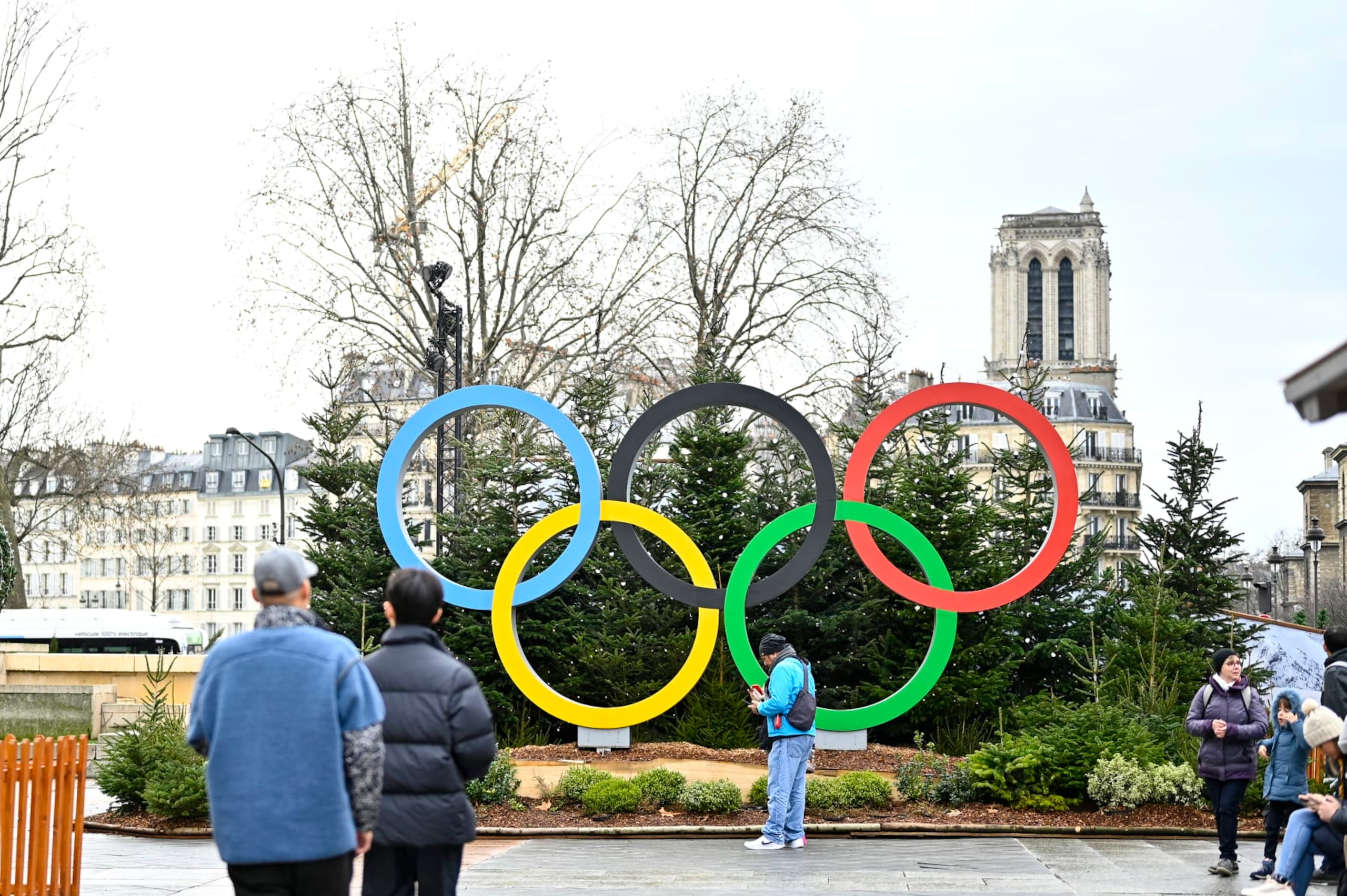 PARIS, FRANCE - DECEMBER 25:  The logo for the Paris 2024 Summer Olympic and Paralympic Games in the Christmas village is shown in front of the Hotel de Ville on December 25, 2022 in Paris, France. Cities around France shine less brightly this Christmas season as local authorities simplify festive decorations in a bid to save energy and lower electricity costs. (Photo by Diego Puletto/Getty Images)