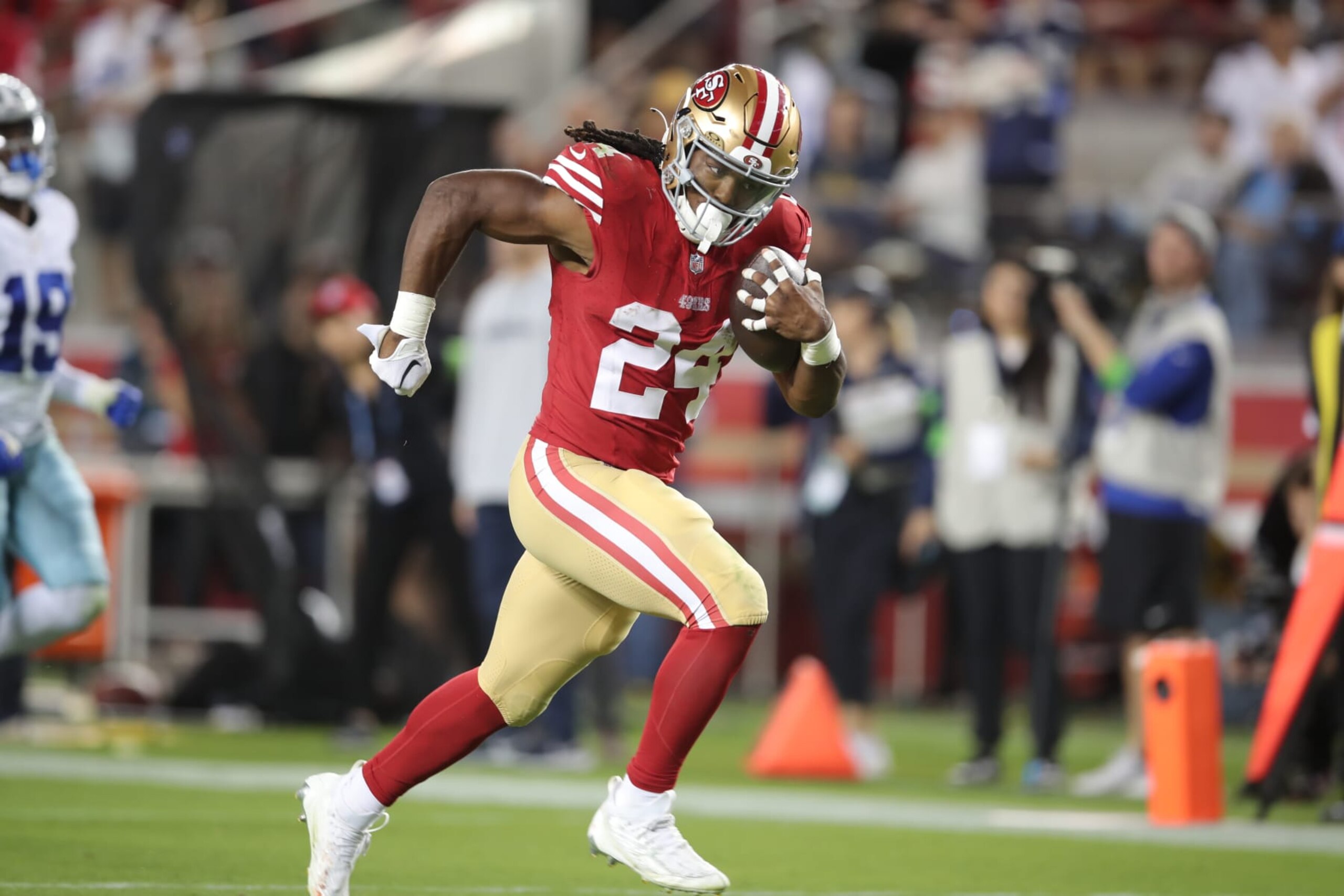SANTA CLARA, CA - OCTOBER 8: Jordan Mason #24 of the San Francisco 49ers rushes for a 26-yard touchdown during game against the Dallas Cowboys at Levi's Stadium on October 8, 2023 in Santa Clara, California. The 49ers defeated the Cowboys 42-10. (Photo by Michael Zagaris/San Francisco 49ers/Getty Images) *** Jordan Mason