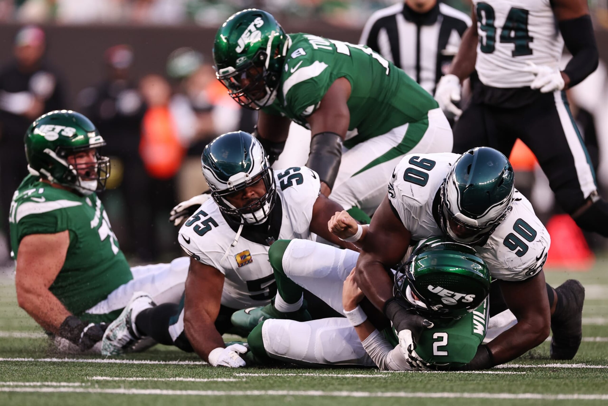 EAST RUTHERFORD, NEW JERSEY - OCTOBER 15: Zach Wilson #2 of the New York Jets is sacked by Jordan Davis #90 and Brandon Graham #55 of the Philadelphia Eagles during the second quarter at MetLife Stadium on October 15, 2023 in East Rutherford, New Jersey. (Photo by Dustin Satloff/Getty Images) EAST RUTHERFORD, NEW JERSEY - OCTOBER 15: Zach Wilson #2 of the New York Jets is sacked by Jordan Davis #90 and Brandon Graham #55 of the Philadelphia Eagles during the second quarter at MetLife Stadium on October 15, 2023 in East Rutherford, New Jersey. (Photo by Dustin Satloff/Getty Images)