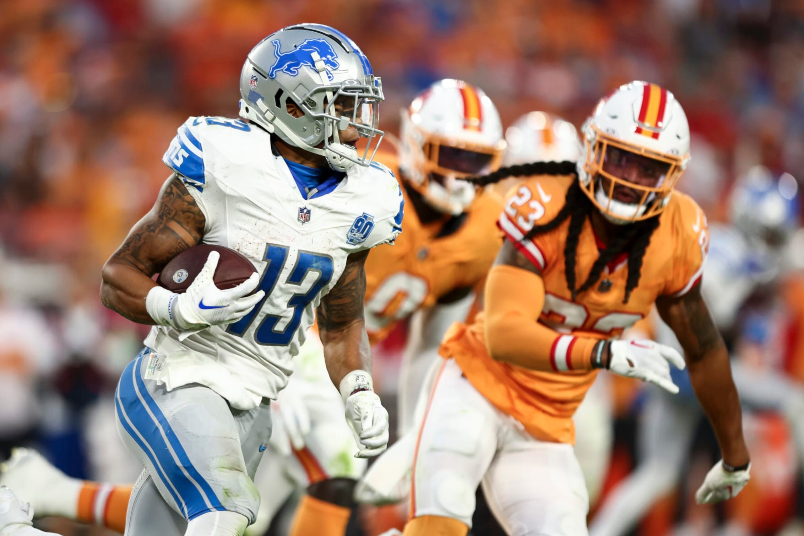 TAMPA, FL - OCTOBER 15: Craig Reynolds #13 of the Detroit Lions carries the ball during the fourth quarter of an NFL football game against the Tampa Bay Buccaneers at Raymond James Stadium on October 15, 2023 in Tampa, Florida. (Photo by Kevin Sabitus/Getty Images)