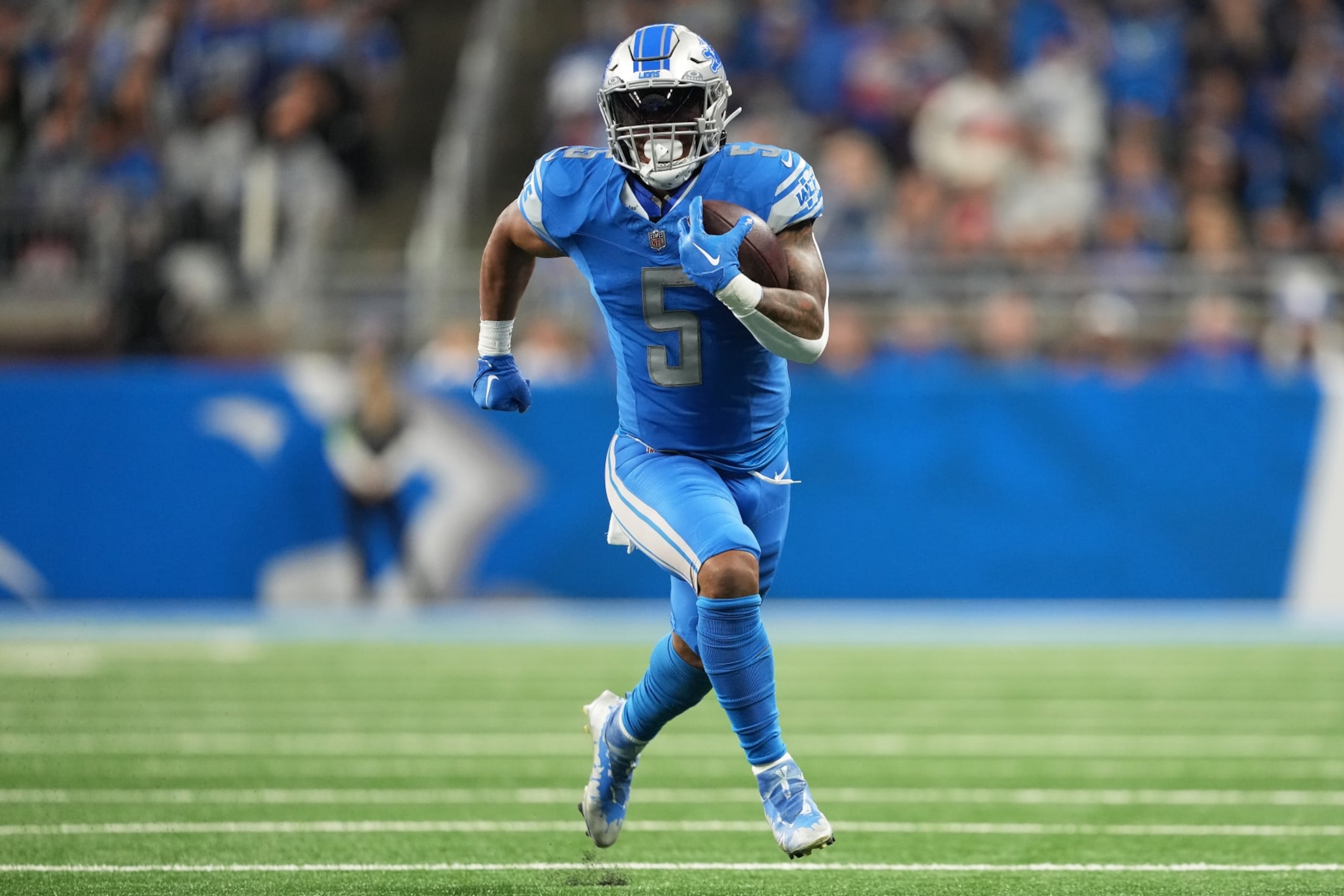DETROIT, MICHIGAN - OCTOBER 08: David Montgomery #5 of the Detroit Lions runs with the ball in the first quarter against the Carolina Panthers at Ford Field on October 08, 2023 in Detroit, Michigan. (Photo by Nic Antaya/Getty Images)