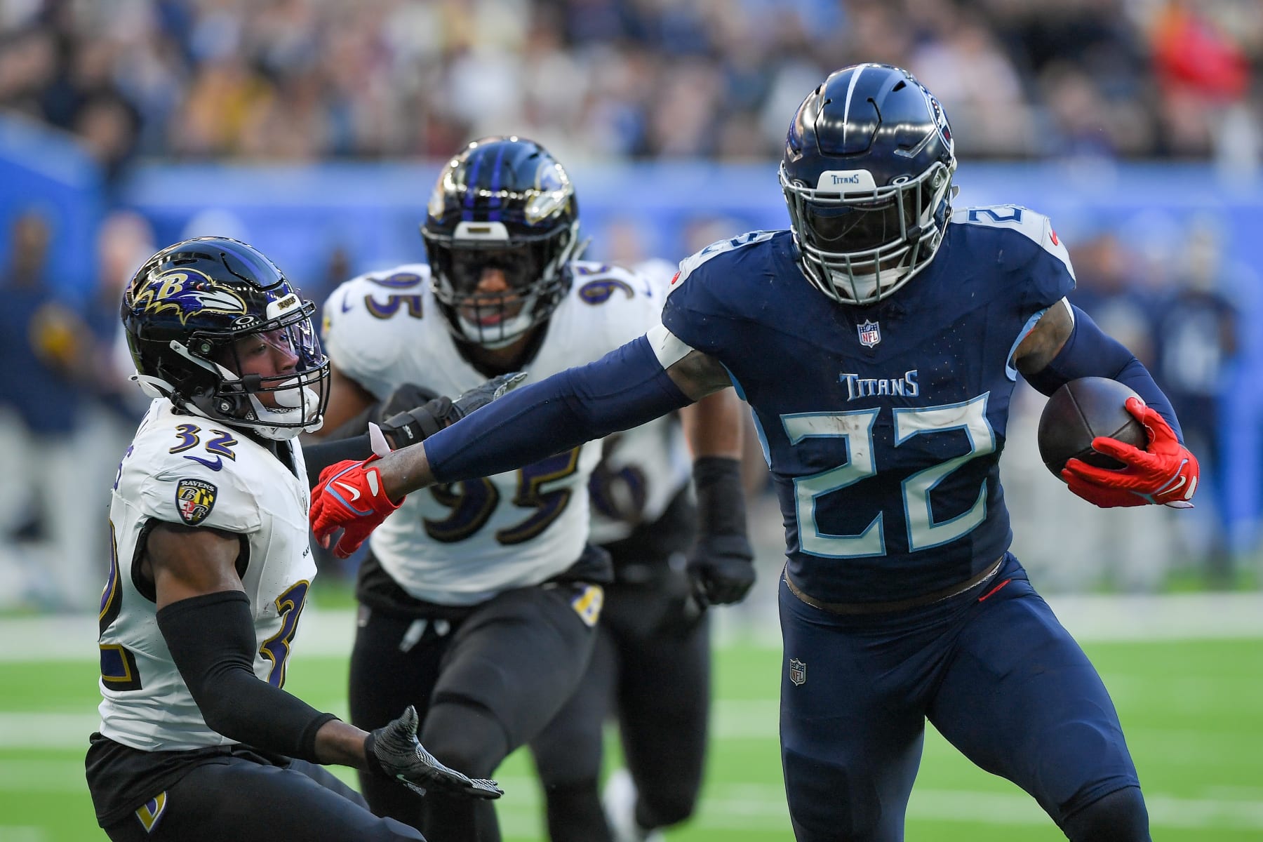 LONDON, ENGLAND - OCTOBER 15: Marcus Williams of Baltimore Ravens and Derrick Henry of Tennessee Titans battle for the ball during the NFL match between Baltimore Ravens and Tennessee Titans at Tottenham Hotspur Stadium on October 15, 2023 in London, England. (Photo by Vincent Mignott/DeFodi Images via Getty Images)