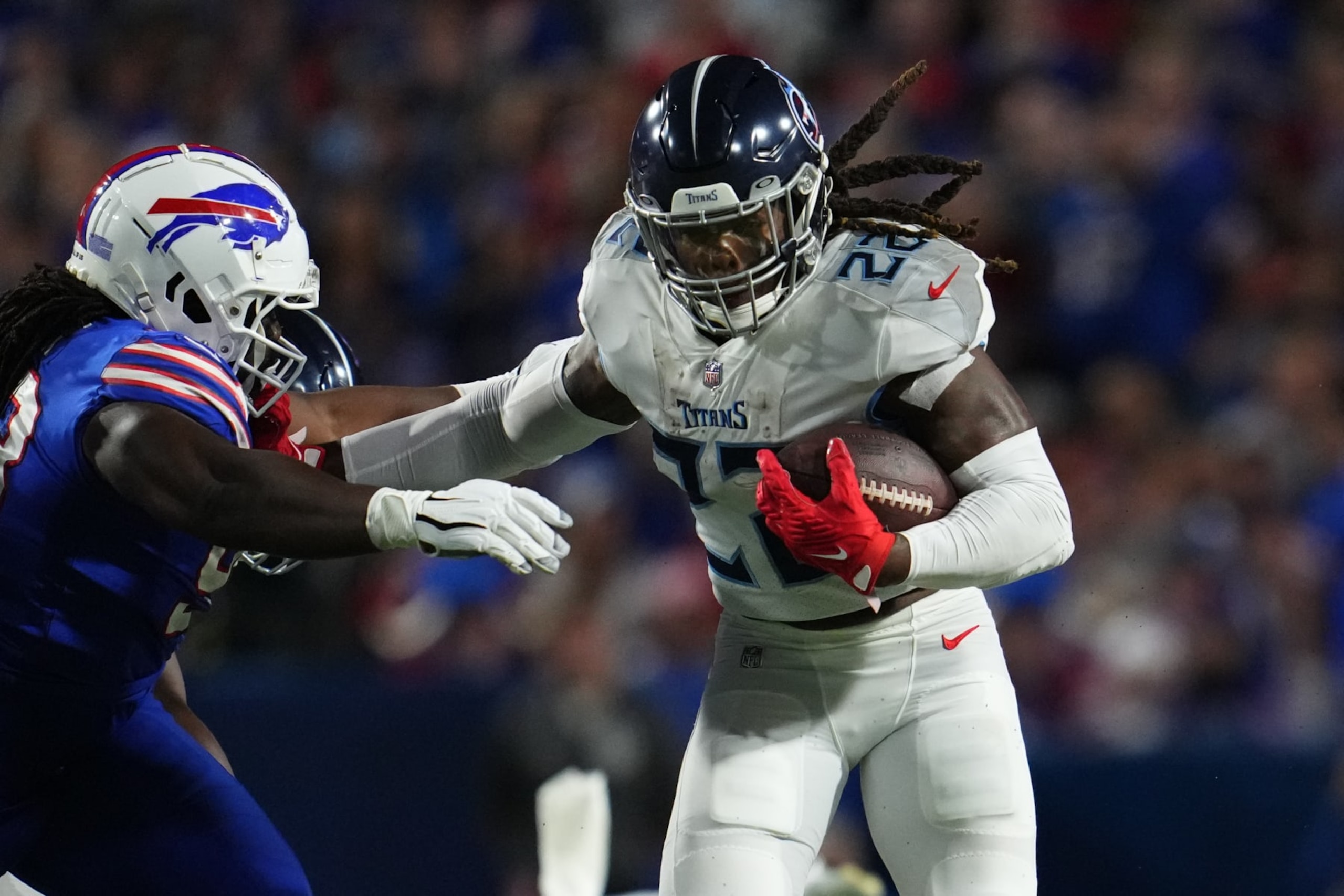 ORCHARD PARK, NY - SEPTEMBER 19: Derrick Henry #22 of the Tennessee Titans runs against the Buffalo Bills at Highmark Stadium on September 19, 2022 in Orchard Park, New York. (Photo by Cooper Neill/Getty Images)