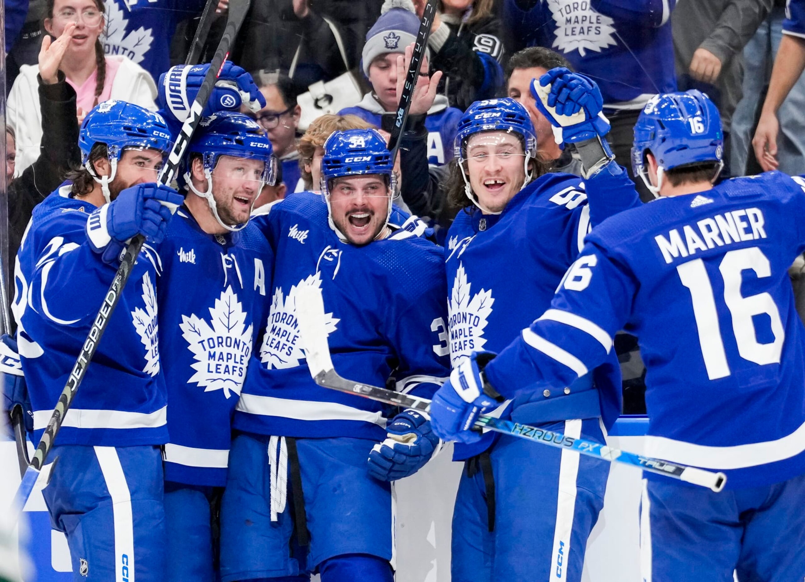 TORONTO, ON - OCTOBER 14: Auston Matthews #34 of the Toronto Maple Leafs celebrates his third goal of the game against the Minnesota Wild with teammates TJ Brodie #78, Morgan Rielly #44, Tyler Bertuzzi #59 and Mitchell Marner #16 during the third period at the Scotiabank Arena on October 14, 2023 in Toronto, Ontario, Canada. (Photo by Andrew Lahodynskyj/NHLI via Getty Images)