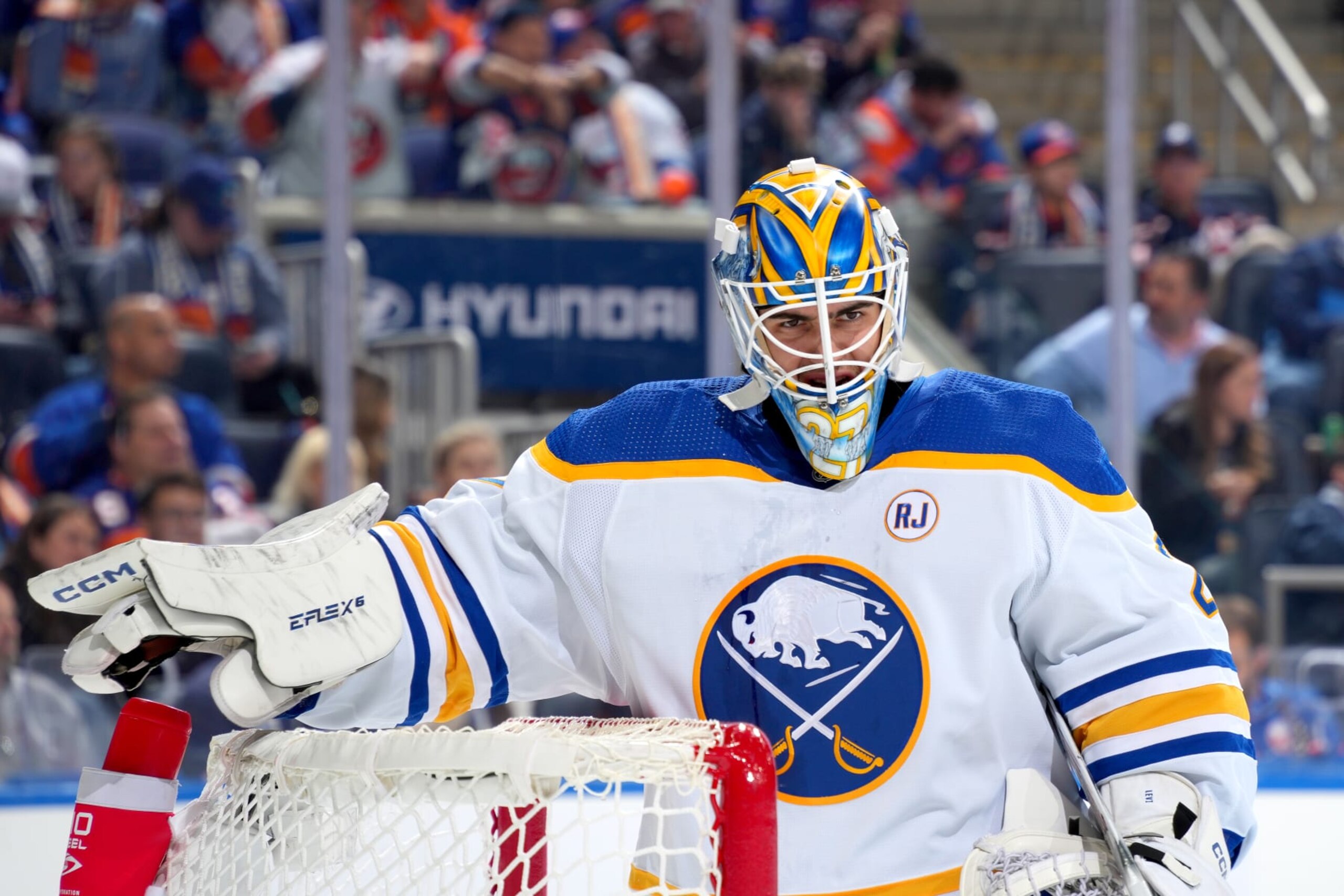 ELMONT, NEW YORK - OCTOBER 14:  Devon Levi #27 of the Buffalo Sabres tends net against the New York Islanders during the first period at UBS Arena on October 14, 2023 in Elmont, New York. (Photo by Mike Stobe/NHLI via Getty Images)