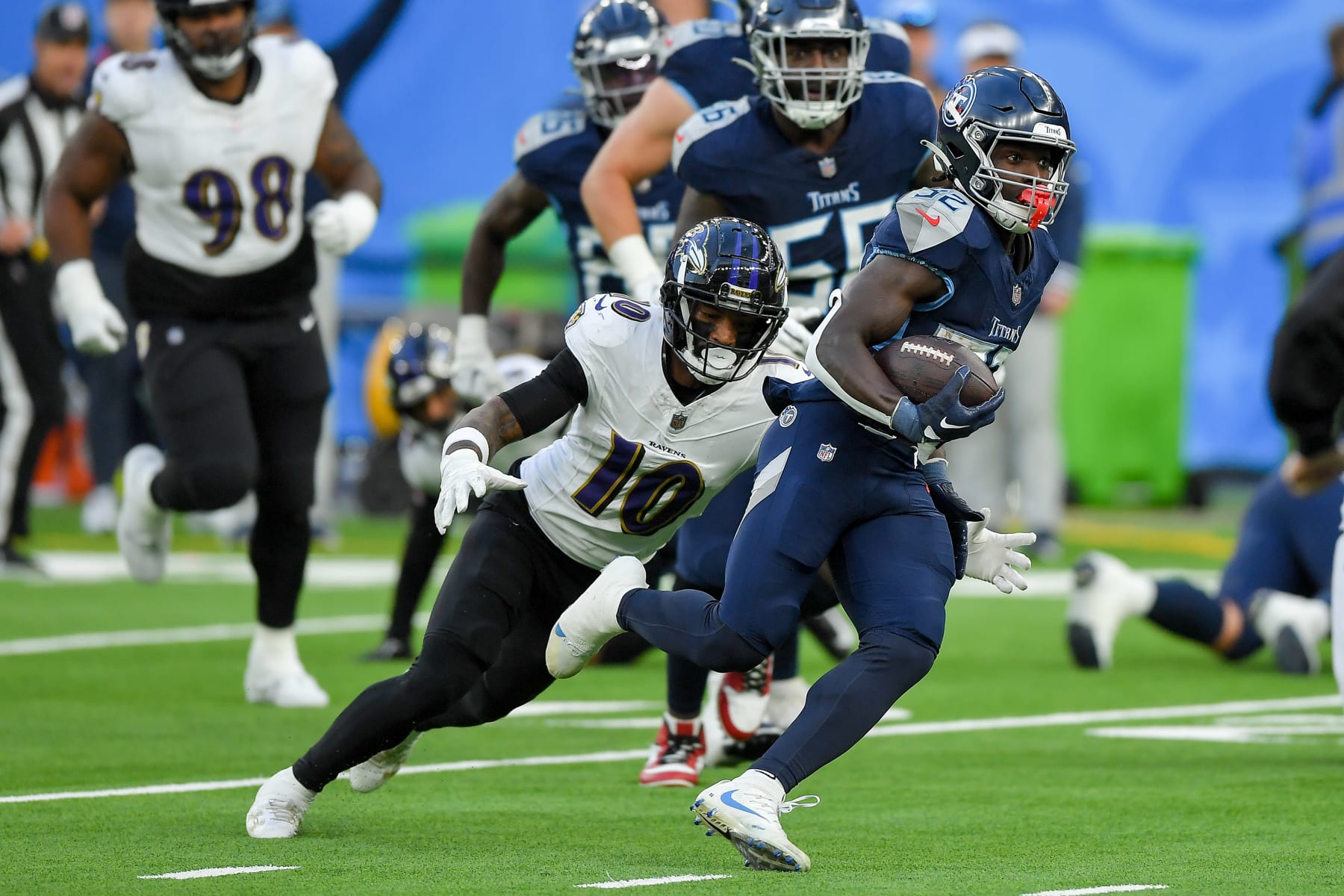 LONDON, ENGLAND - OCTOBER 15: Arthur Maulet of Baltimore Ravens and Tyjae Spears of Tennessee Titans battle for the ball during the NFL match between Baltimore Ravens and Tennessee Titans at Tottenham Hotspur Stadium on October 15, 2023 in London, England. (Photo by Vincent Mignott/DeFodi Images via Getty Images)
