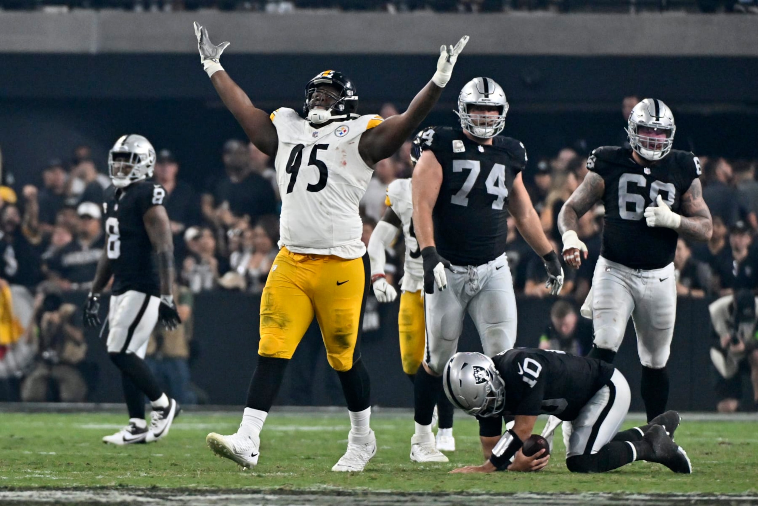 Pittsburgh Steelers defensive tackle Keeanu Benton (95) celebrates after sacking Las Vegas Raiders quarterback Jimmy Garoppolo (10) during the second half of an NFL football game Sunday, Sept. 24, 2023, in Las Vegas. (AP Photo/David Becker) Pittsburgh Steelers defensive tackle Keeanu Benton (95) celebrates after sacking Las Vegas Raiders quarterback Jimmy Garoppolo (10) during the second half of an NFL football game Sunday, Sept. 24, 2023, in Las Vegas. (AP Photo/David Becker)