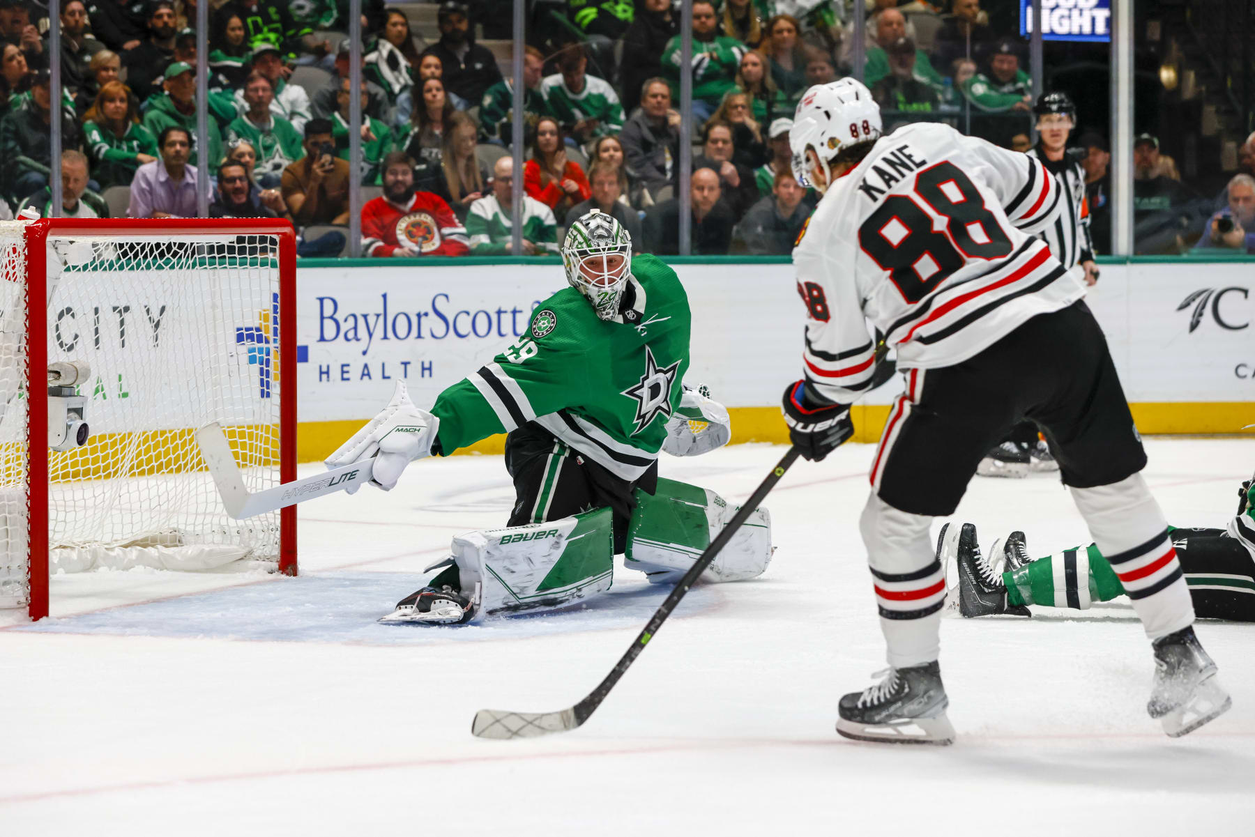 DALLAS, TX - FEBRUARY 22: Chicago Blackhawks right wing Patrick Kane (88) shoots the puck pass Dallas Stars goaltender Jake Oettinger (29) for a goal during the game between the Dallas Stars and the Chicago Blackhawks on February 22, 2023 at American Airlines Center in Dallas, Texas. (Photo by Matthew Pearce/Icon Sportswire via Getty Images)