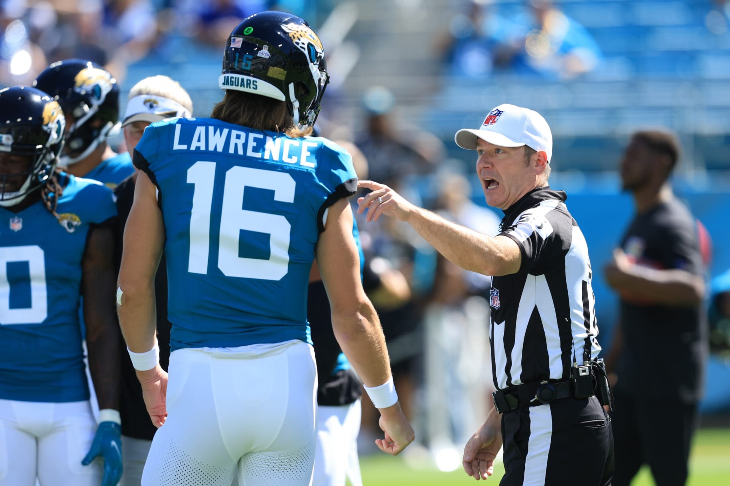 JACKSONVILLE, FLORIDA - OCTOBER 15: Trevor Lawrence #16 of the Jacksonville Jaguars speaks with a referee during warm ups before the game against the Indianapolis Colts at EverBank Stadium on October 15, 2023 in Jacksonville, Florida. (Photo by Sam Greenwood/Getty Images)