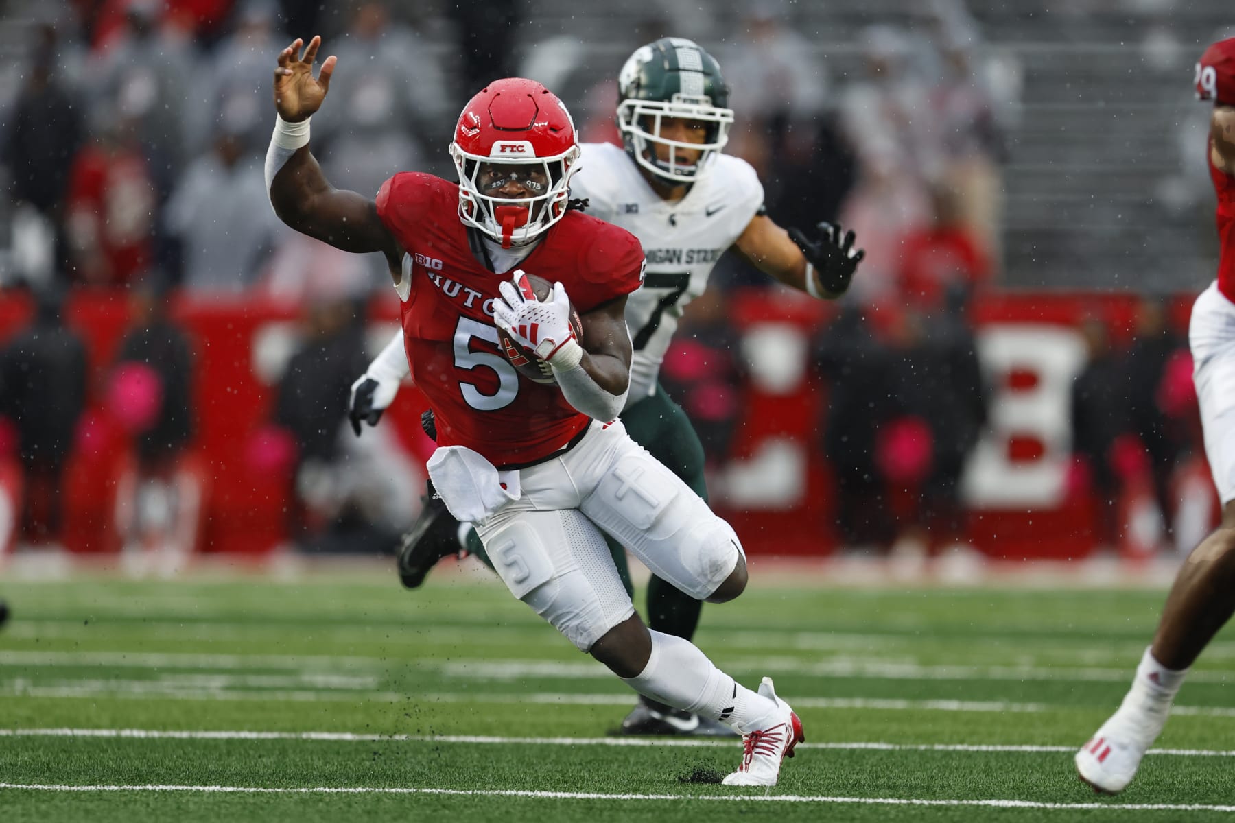 PISCATAWAY, NEW JERSEY - OCTOBER 14: Running back Kyle Monangai #5 of the Rutgers Scarlet Knights runs for long yardage against the Michigan State Spartans during the fourth quarter of a college football game at SHI Stadium on October 14, 2023 in Piscataway, New Jersey. Rutgers defeated the Michigan State Spartans 27-24. (Photo by Rich Schultz/Getty Images)