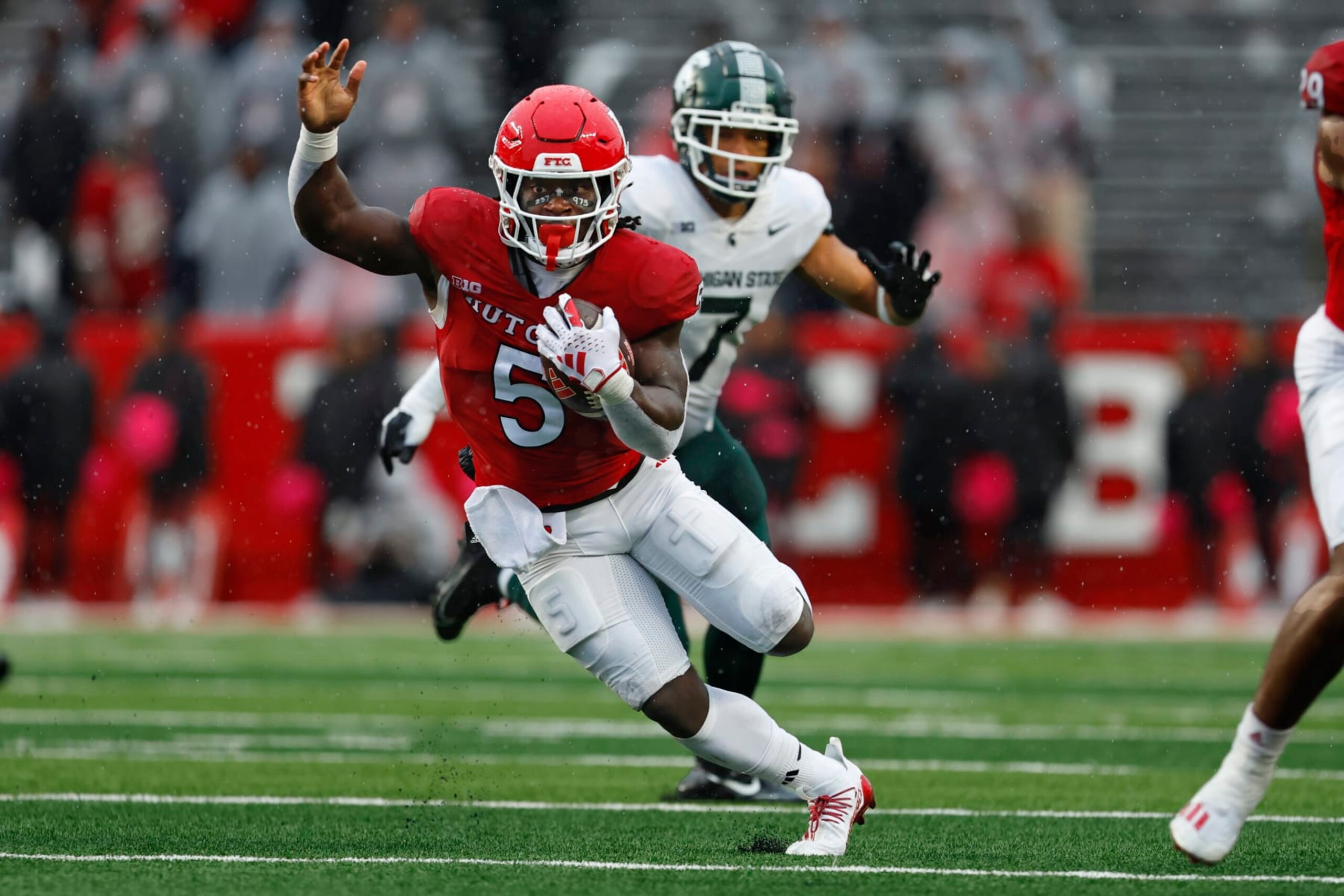 PISCATAWAY, NEW JERSEY - OCTOBER 14: Running back Kyle Monangai #5 of the Rutgers Scarlet Knights runs for long yardage against the Michigan State Spartans during the fourth quarter of a college football game at SHI Stadium on October 14, 2023 in Piscataway, New Jersey. Rutgers defeated the Michigan State Spartans 27-24. (Photo by Rich Schultz/Getty Images) PISCATAWAY, NEW JERSEY - OCTOBER 14: Running back Kyle Monangai #5 of the Rutgers Scarlet Knights runs for long yardage against the Michigan State Spartans during the fourth quarter of a college football game at SHI Stadium on October 14, 2023 in Piscataway, New Jersey. Rutgers defeated the Michigan State Spartans 27-24. (Photo by Rich Schultz/Getty Images)