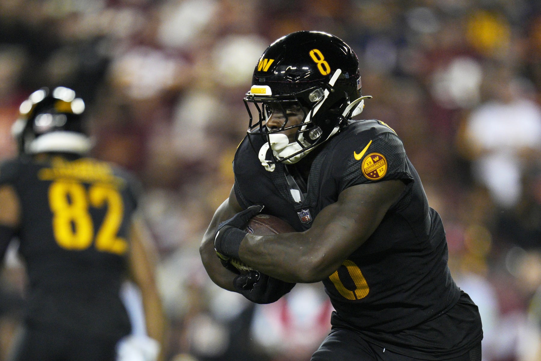 LANDOVER, MARYLAND - OCTOBER 05: Brian Robinson Jr. #8 of the Washington Commanders runs with the ball against the Chicago Bears during the first quarter at FedExField on October 05, 2023 in Landover, Maryland. (Photo by Jess Rapfogel/Getty Images)