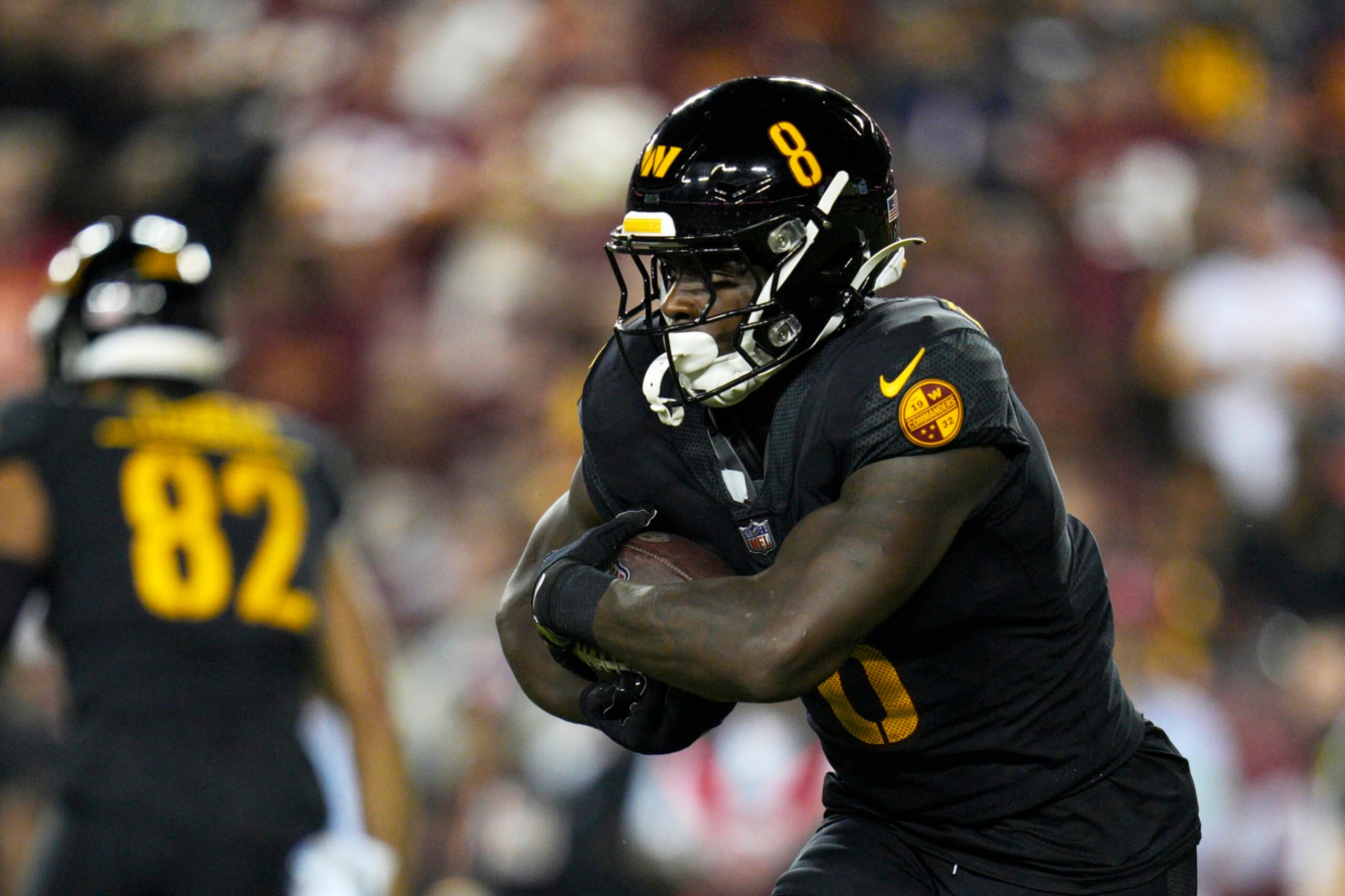 LANDOVER, MARYLAND - OCTOBER 05: Brian Robinson Jr. #8 of the Washington Commanders runs with the ball against the Chicago Bears during the first quarter at FedExField on October 05, 2023 in Landover, Maryland. (Photo by Jess Rapfogel/Getty Images)