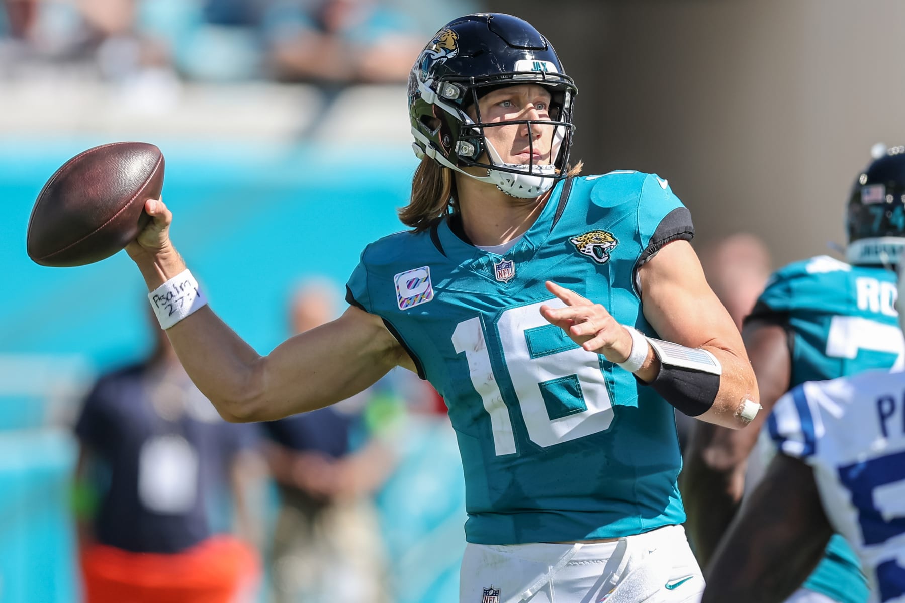 JACKSONVILLE, FLORIDA - OCTOBER 15: Trevor Lawrence #16 of the Jacksonville Jaguars looks to pass against the Indianapolis Colts at EverBank Stadium on October 15, 2023 in Jacksonville, Florida. (Photo by Mike Carlson/Getty Images)