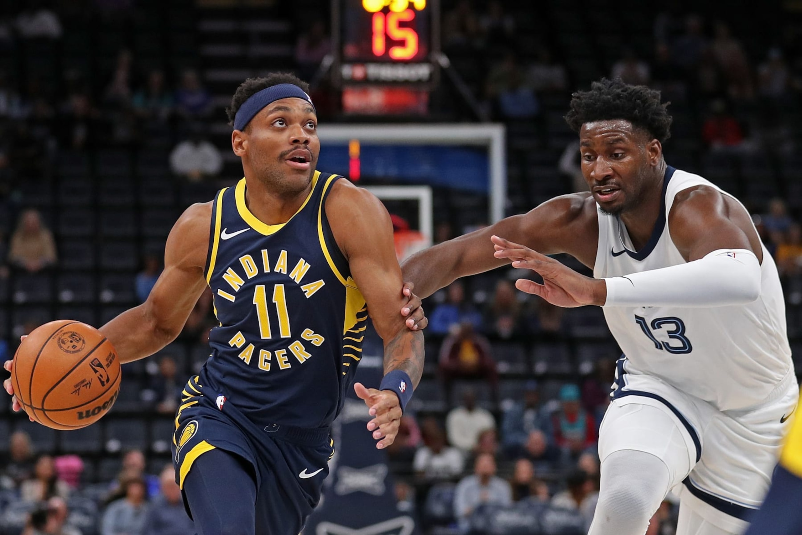 MEMPHIS, TENNESSEE - OCTOBER 08: Bruce Brown #11 of the Indiana Pacers drives to the basket against Jaren Jackson Jr. #13 of the Memphis Grizzlies in the first half at FedExForum on October 08, 2023 in Memphis, Tennessee. NOTE TO USER: User expressly acknowledges and agrees that, by downloading and or using this photograph, User is consenting to the terms and conditions of the Getty Images License Agreement. (Photo by Justin Ford/Getty Images)