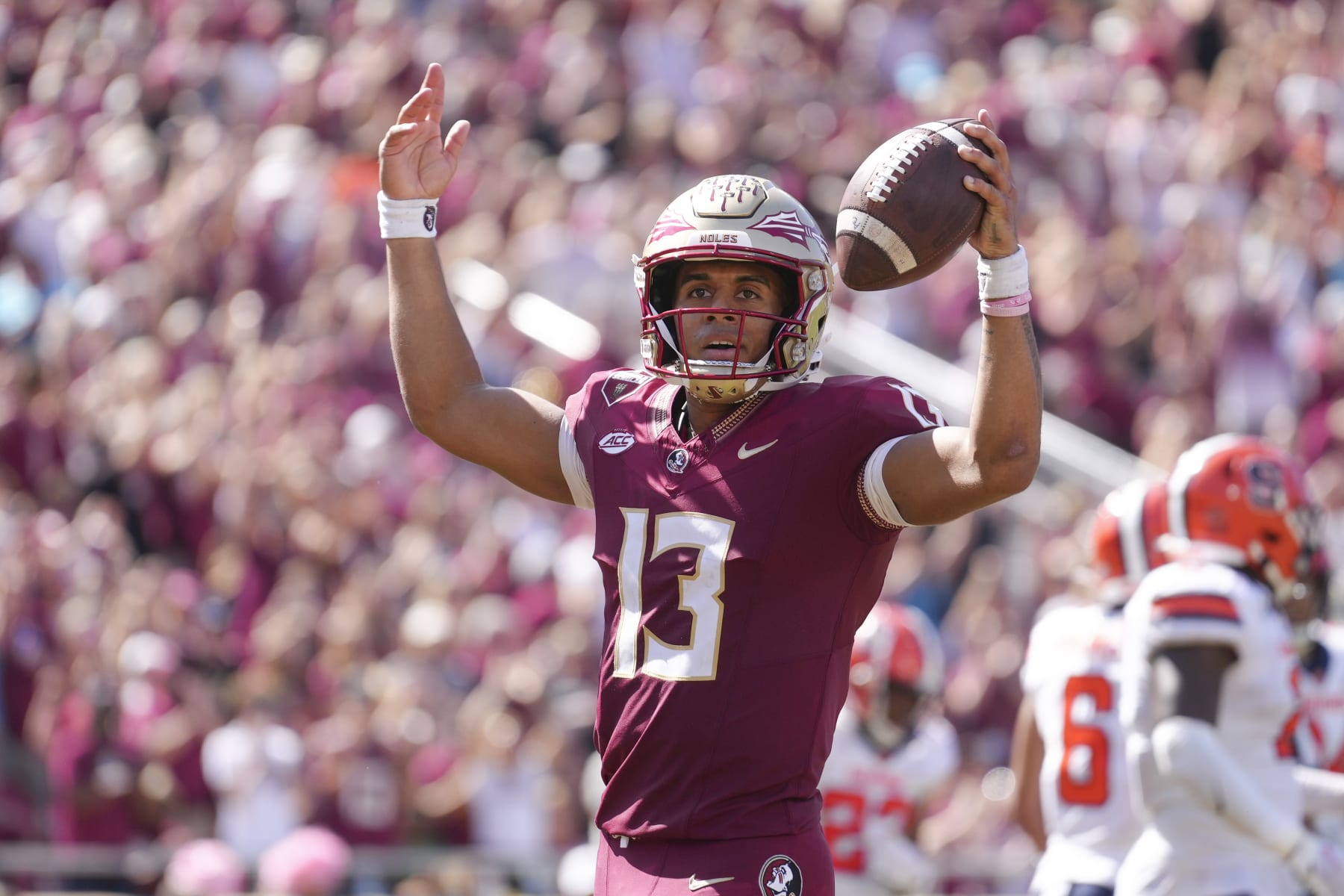 TALLAHASSEE, FL - OCTOBER 14: Florida State Seminoles quarterback Jordan Travis (13) celebrates after breaking the school touchdown record with this touchdown in the second half during the game between the Syracuse Orange and the Florida State Seminoles on Saturday, October 14, 2023 at Bobby Bowden Field at Doak Campbell Stadium, Tallahassee, Fla. (Photo by Peter Joneleit/Icon Sportswire via Getty Images)