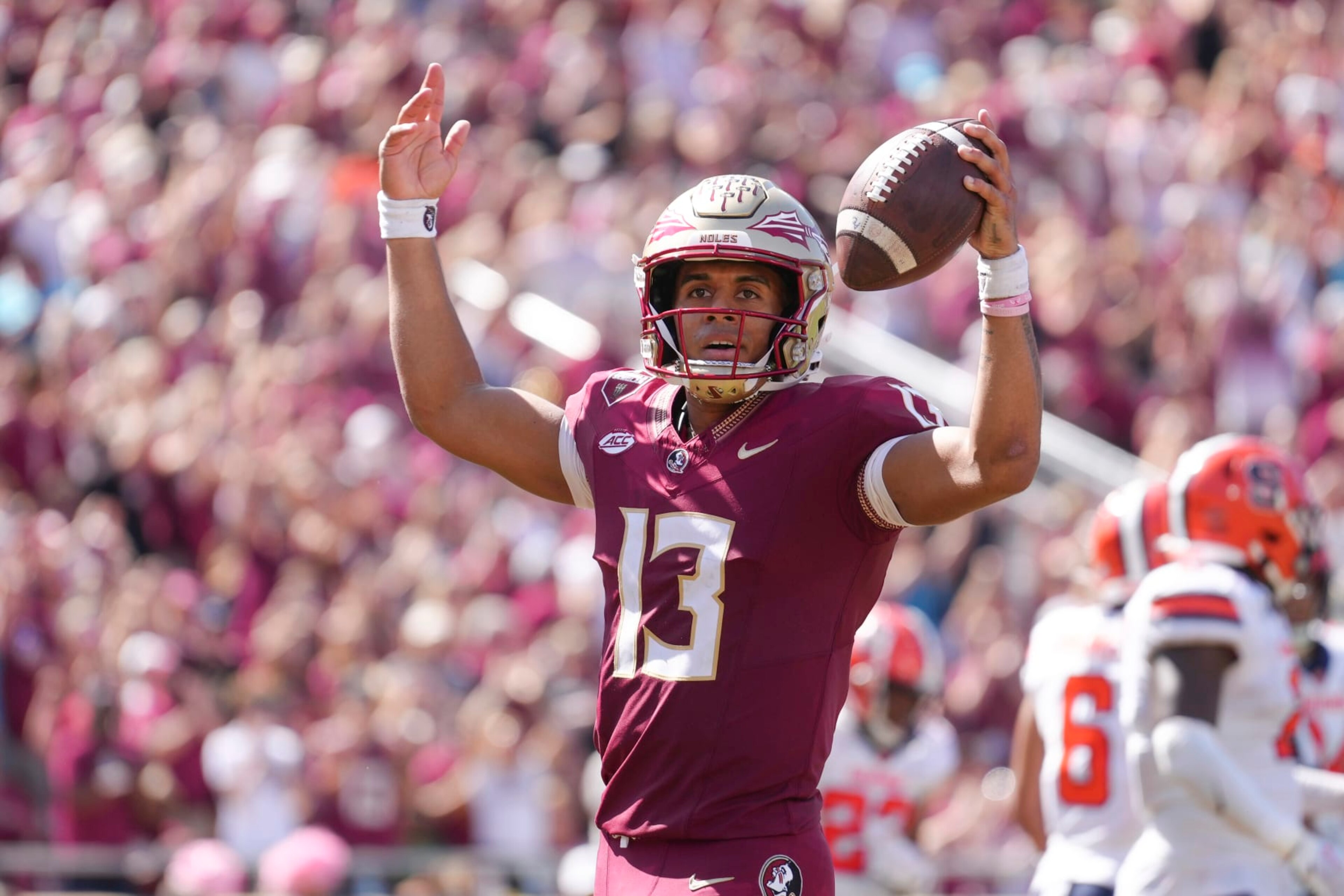TALLAHASSEE, FL - OCTOBER 14: Florida State Seminoles quarterback Jordan Travis (13) celebrates after breaking the school touchdown record with this touchdown in the second half during the game between the Syracuse Orange and the Florida State Seminoles on Saturday, October 14, 2023 at Bobby Bowden Field at Doak Campbell Stadium, Tallahassee, Fla. (Photo by Peter Joneleit/Icon Sportswire via Getty Images) TALLAHASSEE, FL - OCTOBER 14: Florida State Seminoles quarterback Jordan Travis (13) celebrates after breaking the school touchdown record with this touchdown in the second half during the game between the Syracuse Orange and the Florida State Seminoles on Saturday, October 14, 2023 at Bobby Bowden Field at Doak Campbell Stadium, Tallahassee, Fla. (Photo by Peter Joneleit/Icon Sportswire via Getty Images)