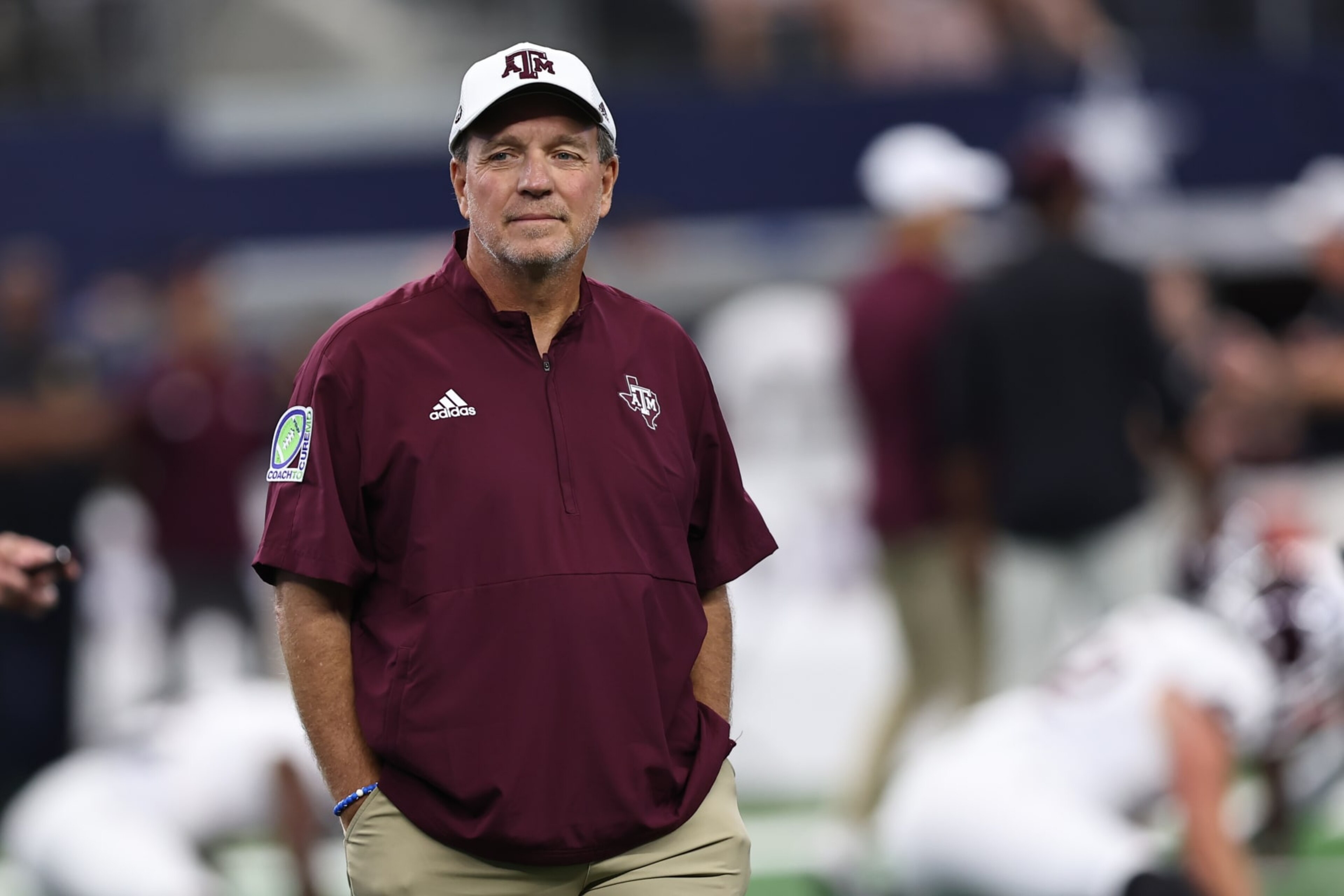 ARLINGTON, TX - SEPTEMBER 30: Aggies head coach Jimbo Fisher watches his team warm up before the Southwest Classic between the Arkansas Razorbacks and the Texas A&M Aggies on September 30, 2023 at AT&T Stadium in Arlington, TX (Photo by John Bunch/Icon Sportswire via Getty Images) ARLINGTON, TX - SEPTEMBER 30: Aggies head coach Jimbo Fisher watches his team warm up before the Southwest Classic between the Arkansas Razorbacks and the Texas A&M Aggies on September 30, 2023 at AT&T Stadium in Arlington, TX (Photo by John Bunch/Icon Sportswire via Getty Images)