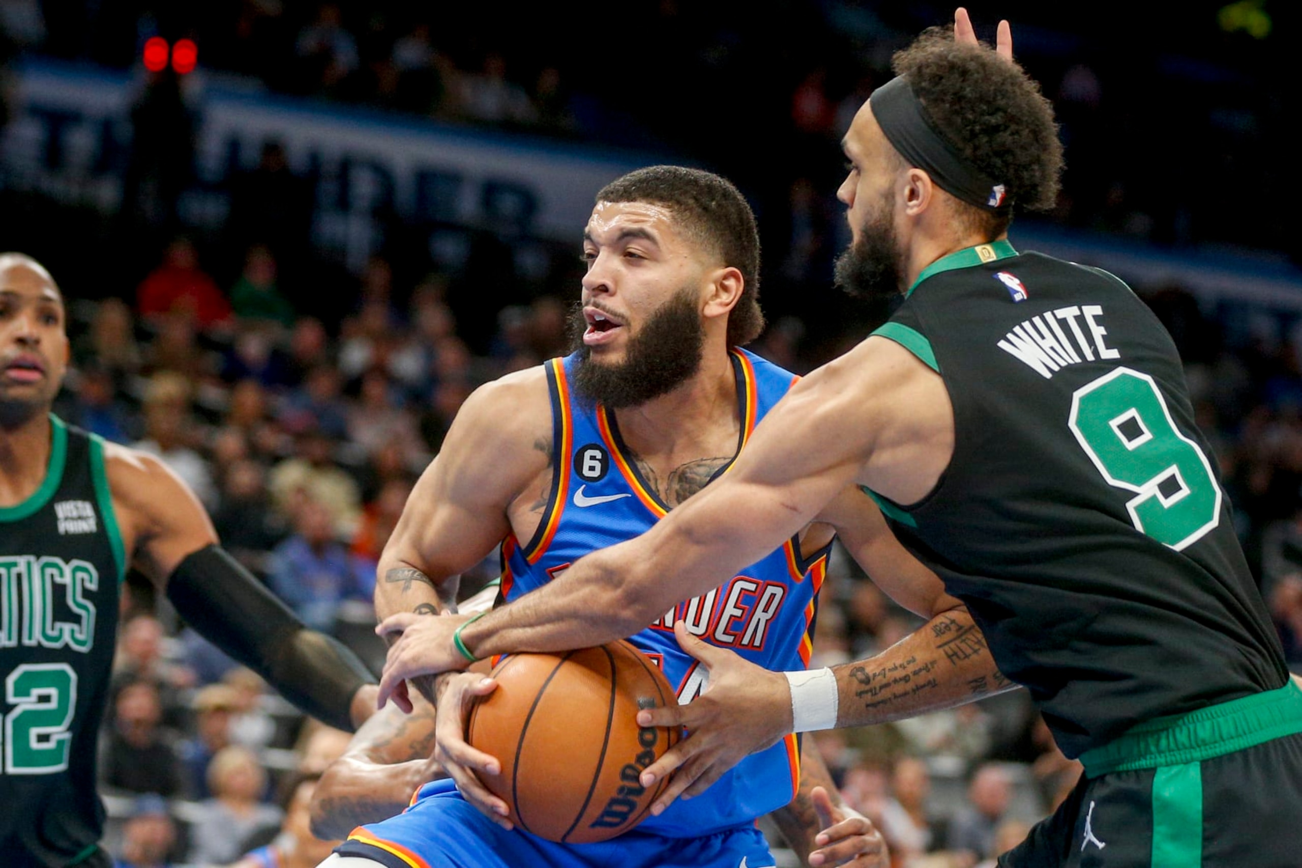 OKLAHOMA CITY, OKLAHOMA - JANUARY 03: Kenrich Williams #34 of the Oklahoma City Thunder grabs a rebound over Derrick White #9 of the Boston Celtics during the first quarter at Paycom Center on January 03, 2023 in Oklahoma City, Oklahoma. NOTE TO USER: User expressly acknowledges and agrees that, by downloading and or using this photograph, User is consenting to the terms and conditions of the Getty Images License Agreement. (Photo by Ian Maule/Getty Images) OKLAHOMA CITY, OKLAHOMA - JANUARY 03: Kenrich Williams #34 of the Oklahoma City Thunder grabs a rebound over Derrick White #9 of the Boston Celtics during the first quarter at Paycom Center on January 03, 2023 in Oklahoma City, Oklahoma. NOTE TO USER: User expressly acknowledges and agrees that, by downloading and or using this photograph, User is consenting to the terms and conditions of the Getty Images License Agreement. (Photo by Ian Maule/Getty Images)