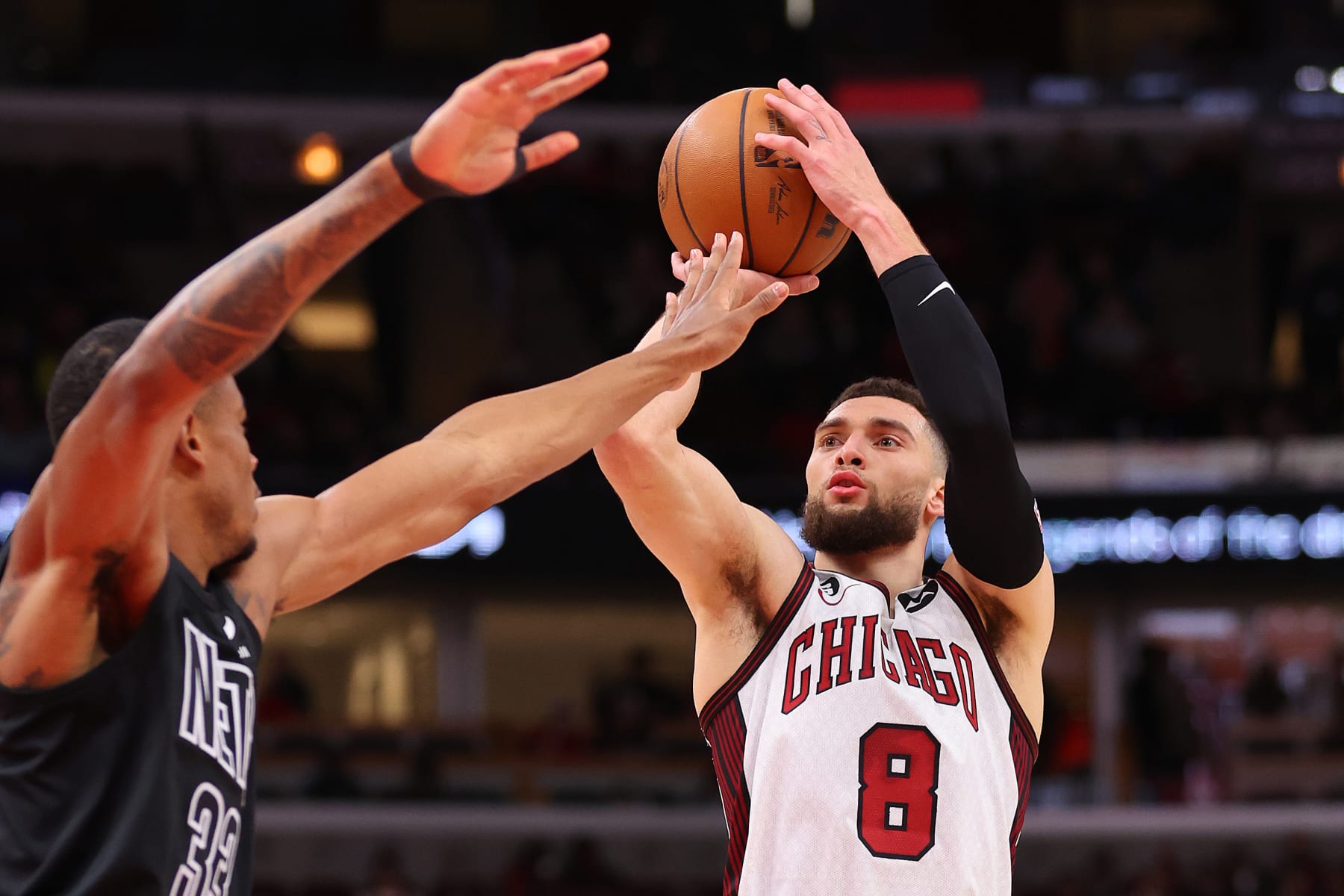 CHICAGO, ILLINOIS - FEBRUARY 24: Zach LaVine #8 of the Chicago Bulls shoots over Nic Claxton #33 of the Brooklyn Nets during the second half at United Center on February 24, 2023 in Chicago, Illinois. NOTE TO USER: User expressly acknowledges and agrees that, by downloading and or using this photograph, User is consenting to the terms and conditions of the Getty Images License Agreement.  (Photo by Michael Reaves/Getty Images)