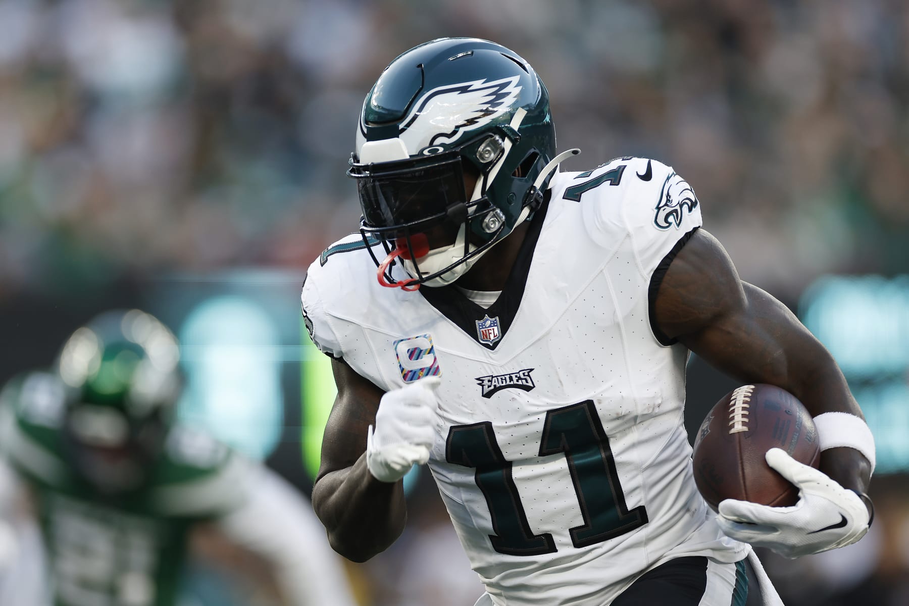EAST RUTHERFORD, NEW JERSEY - OCTOBER 15: A.J. Brown #11 of the Philadelphia Eagles runs the ball during the first half in the game against the New York Jets at MetLife Stadium on October 15, 2023 in East Rutherford, New Jersey. (Photo by Sarah Stier/Getty Images)