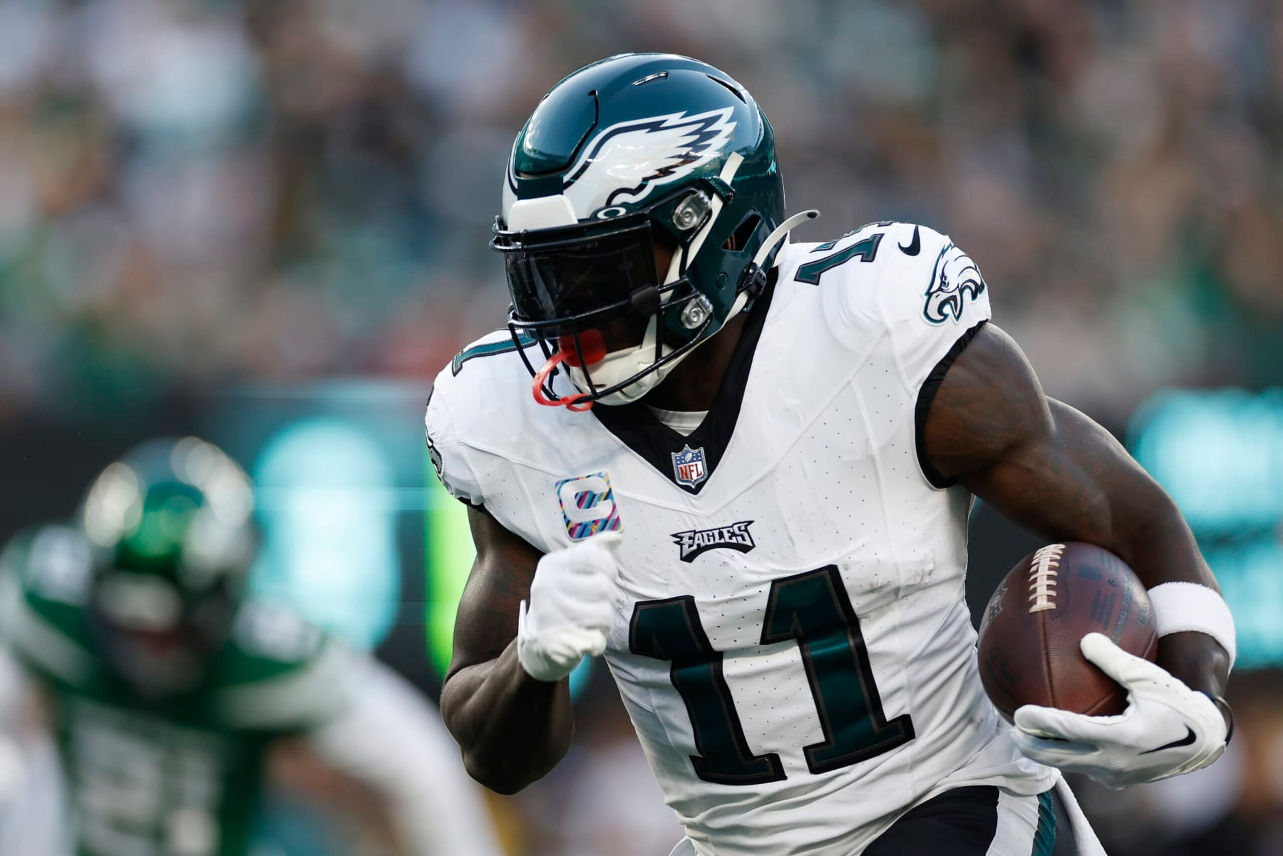 EAST RUTHERFORD, NEW JERSEY - OCTOBER 15: A.J. Brown #11 of the Philadelphia Eagles runs the ball during the first half in the game against the New York Jets at MetLife Stadium on October 15, 2023 in East Rutherford, New Jersey. (Photo by Sarah Stier/Getty Images)