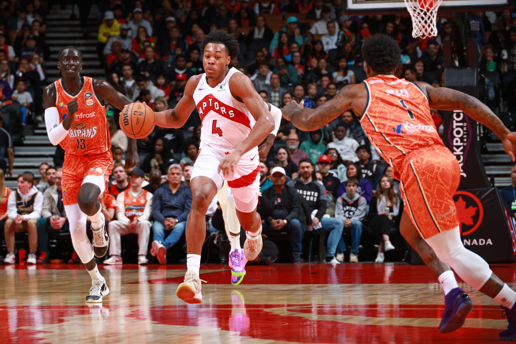 TORONTO, CANADA - OCTOBER 15: Scottie Barnes #4 of the Toronto Raptors dribbles the ball during the game against the Cairns Taipans on October 15, 2023 at the Scotiabank Arena in Toronto, Ontario, Canada.  NOTE TO USER: User expressly acknowledges and agrees that, by downloading and or using this Photograph, user is consenting to the terms and conditions of the Getty Images License Agreement.  Mandatory Copyright Notice: Copyright 2023 NBAE (Photo by Vaughn Ridley/NBAE via Getty Images)