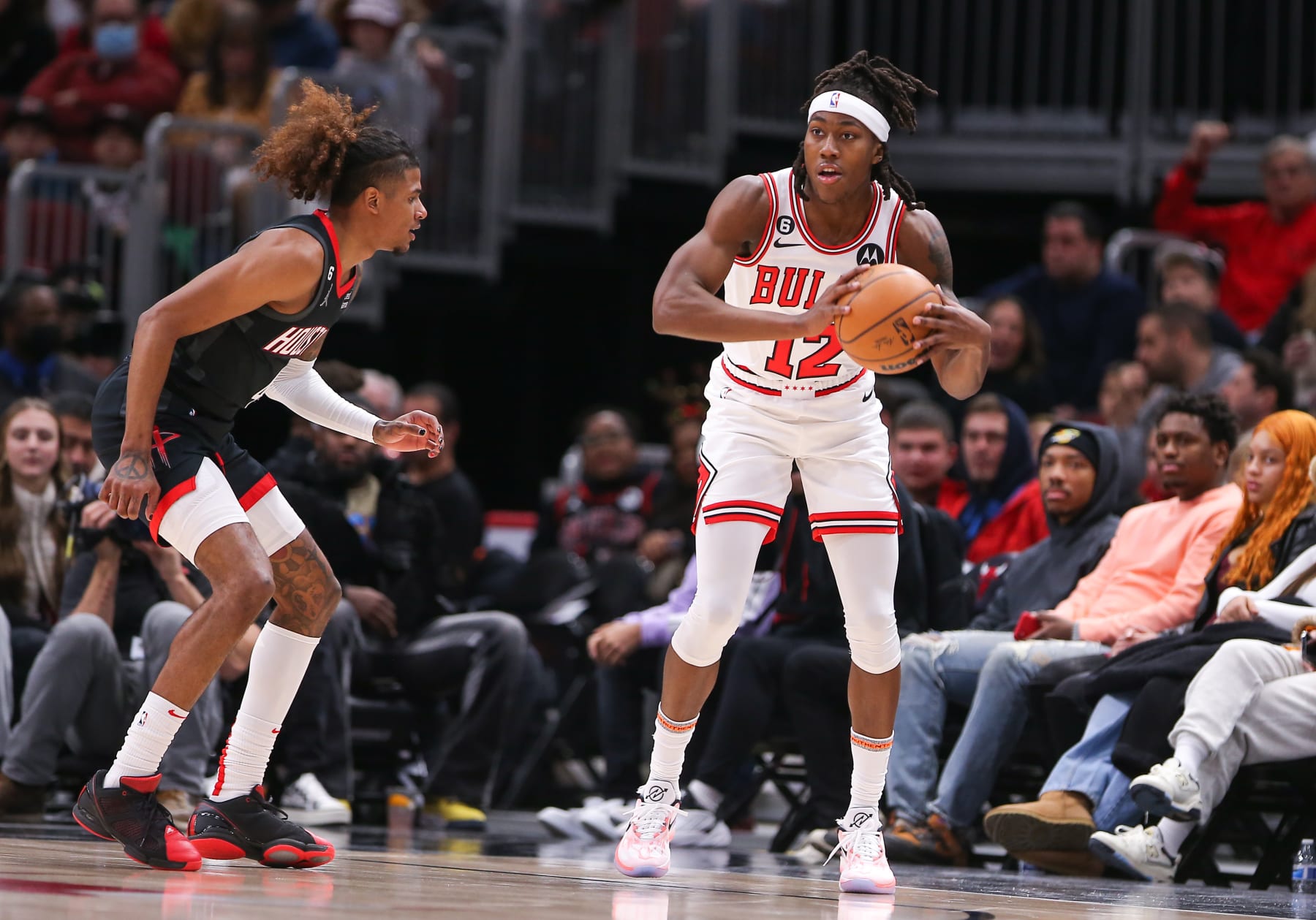 CHICAGO, IL - DECEMBER 26: Houston Rockets Guard Jalen Green (4) guards Chicago Bulls Guard Ayo Dosunmu (12) during a NBA game between the Houston Rockets and the Chicago Bulls on December  26, 2022 at the United Center in Chicago, IL. (Photo by Melissa Tamez/Icon Sportswire via Getty Images)