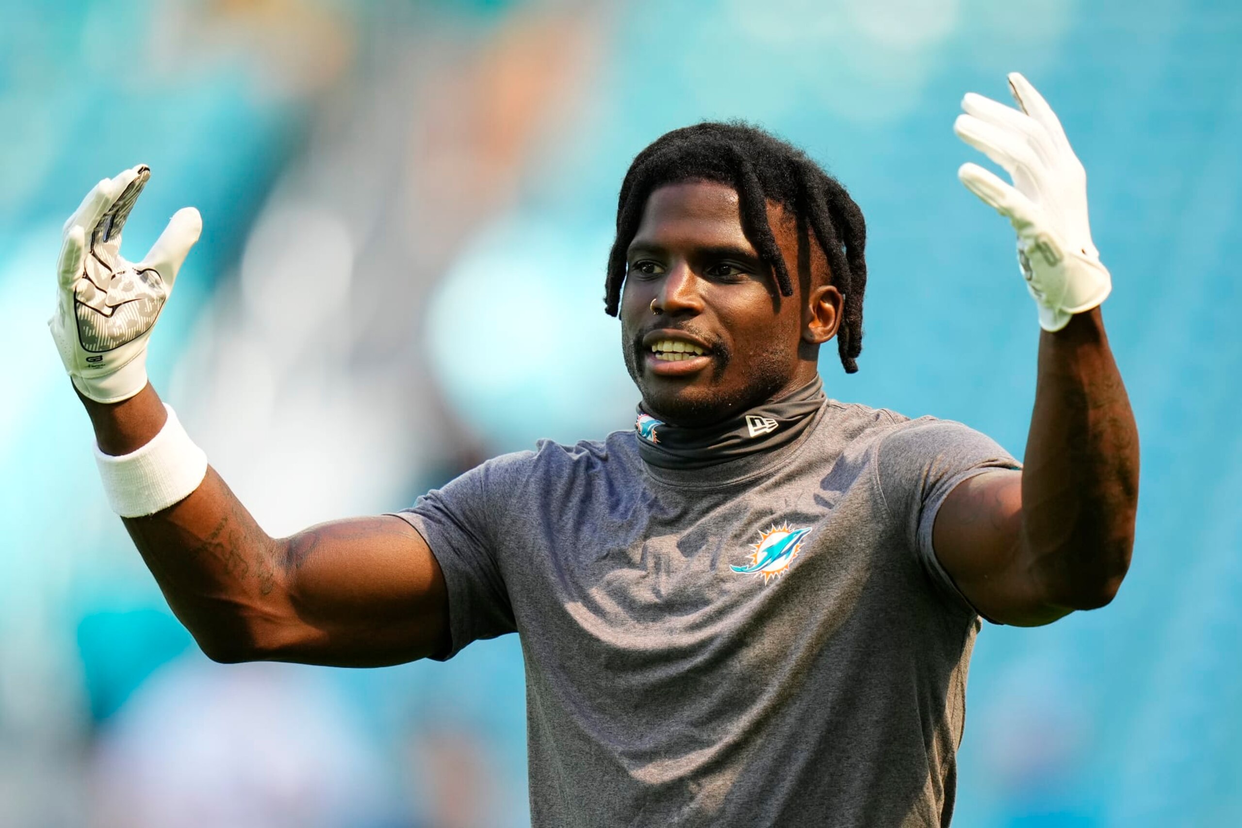 MIAMI GARDENS, FLORIDA - OCTOBER 15: Tyreek Hill #10 of the Miami Dolphins warms up before the game against the Carolina Panthers at Hard Rock Stadium on October 15, 2023 in Miami Gardens, Florida. (Photo by Rich Storry/Getty Images)