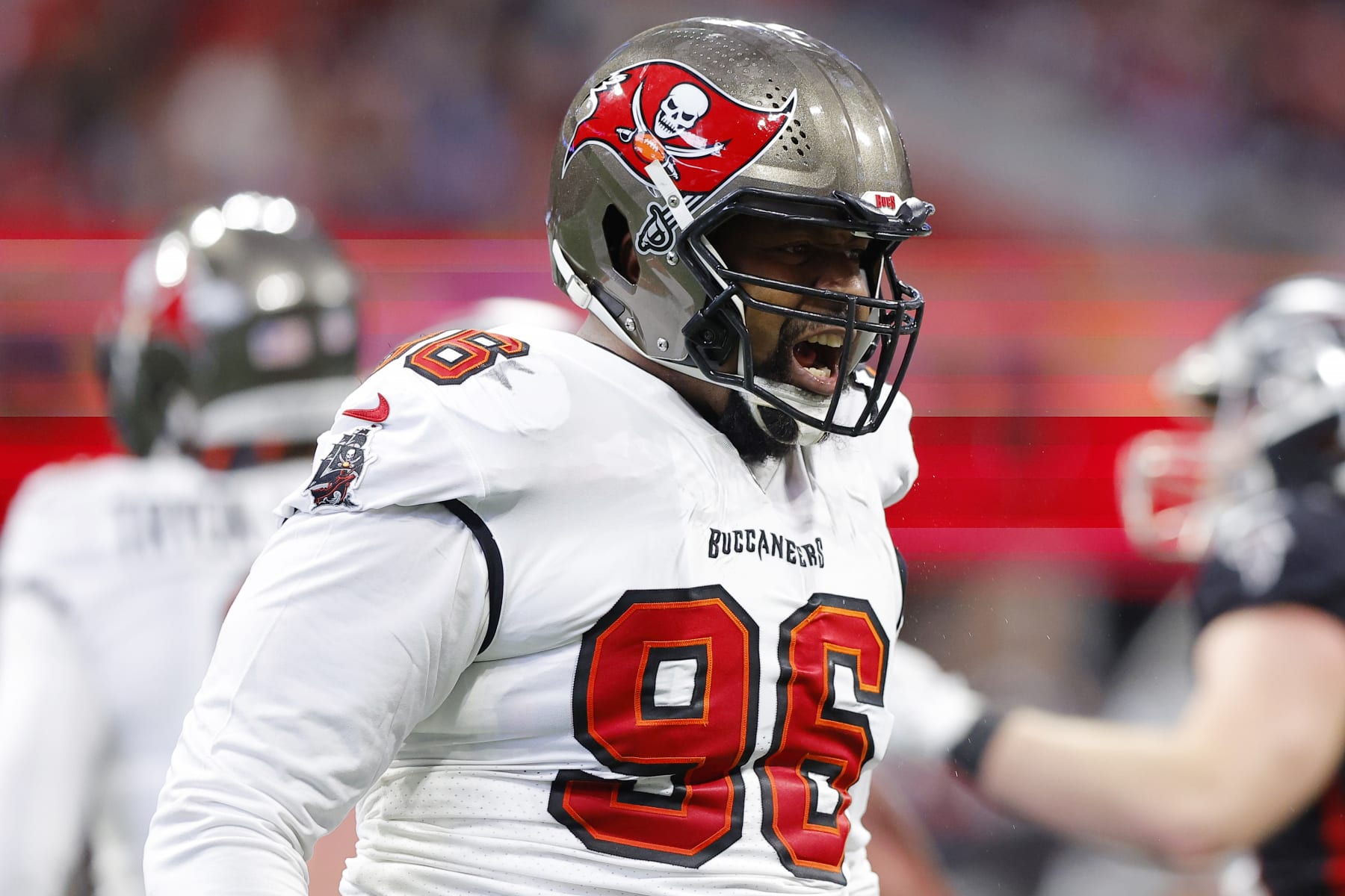 ATLANTA, GEORGIA - JANUARY 08: Akiem Hicks #96 of the Tampa Bay Buccaneers reacts after a play during the second quarter against the Atlanta Falcons at Mercedes-Benz Stadium on January 08, 2023 in Atlanta, Georgia. (Photo by Todd Kirkland/Getty Images)