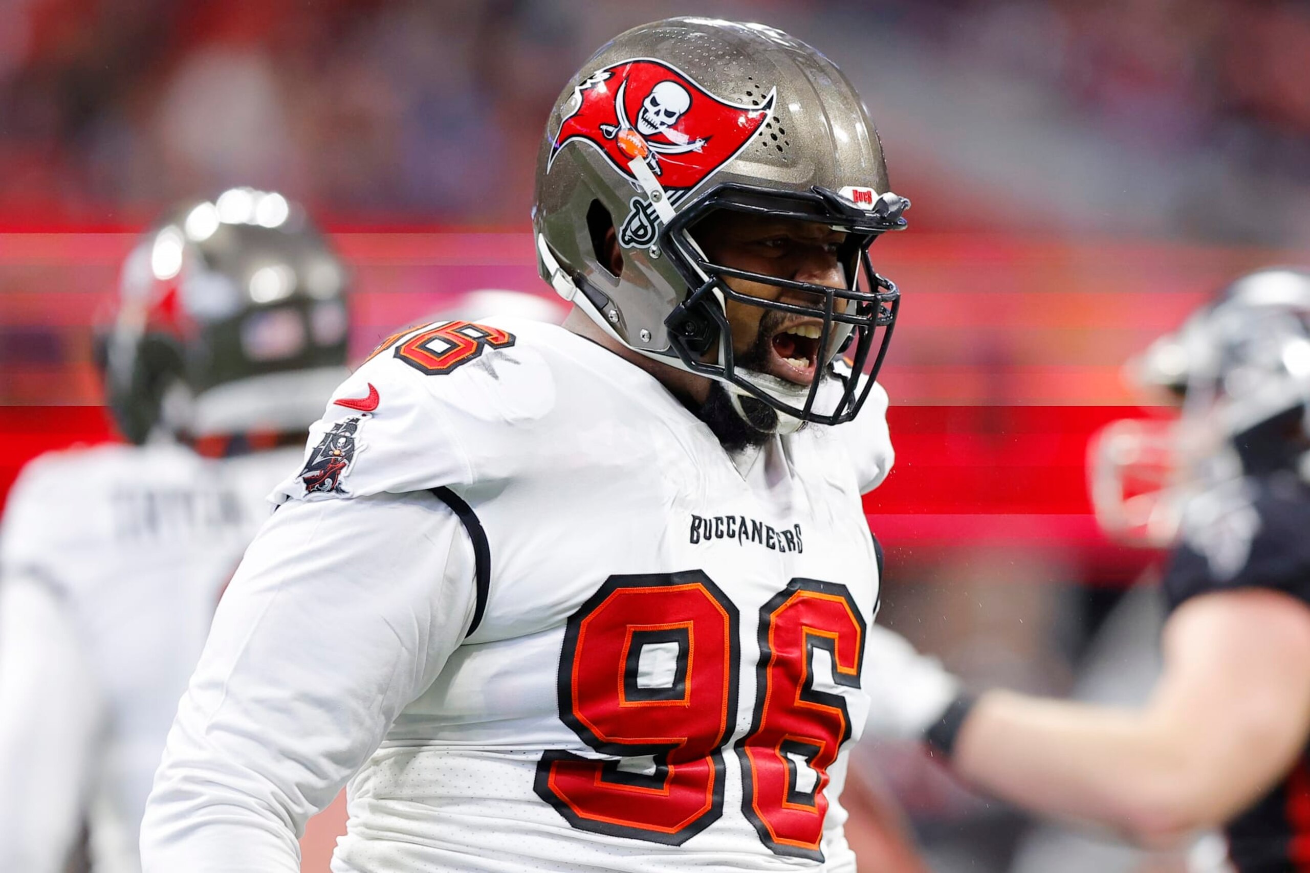 ATLANTA, GEORGIA - JANUARY 08: Akiem Hicks #96 of the Tampa Bay Buccaneers reacts after a play during the second quarter against the Atlanta Falcons at Mercedes-Benz Stadium on January 08, 2023 in Atlanta, Georgia. (Photo by Todd Kirkland/Getty Images)