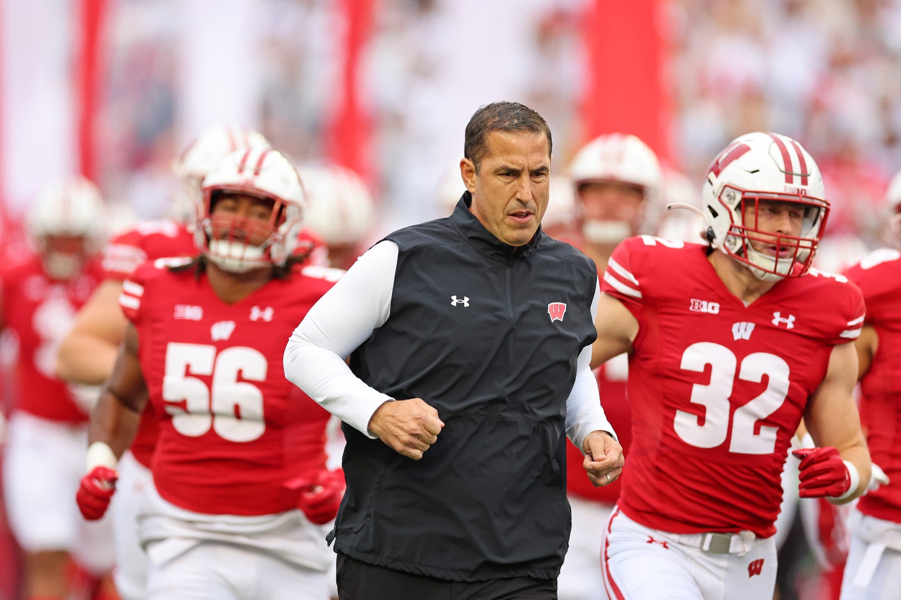 MADISON, WISCONSIN - OCTOBER 14: Head coach Luke Fickell of the Wisconsin Badgers leads his team onto the field for a game against the Iowa Hawkeyes at Camp Randall Stadium on October 14, 2023 in Madison, Wisconsin. (Photo by Stacy Revere/Getty Images)