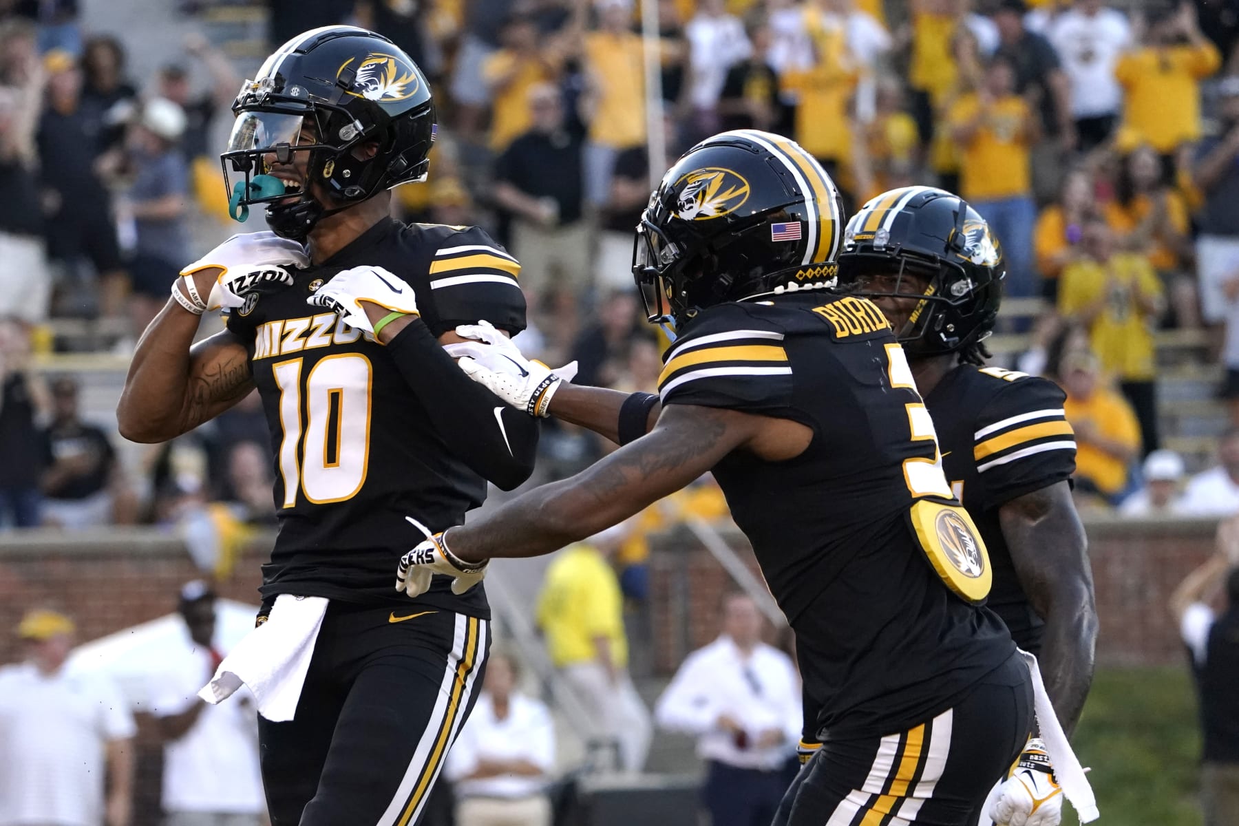COLUMBIA, MISSOURI - AUGUST 31: Wide receiver Mekhi Miller #10 of the Missouri Tigers celebrates a touchdown reception with wide receiver Luther Burden III #3 against the South Dakota Coyotes in the first half at Faurot Field/Memorial Stadium on August 31, 2023 in Columbia, Missouri. (Photo by Ed Zurga/Getty Images)
