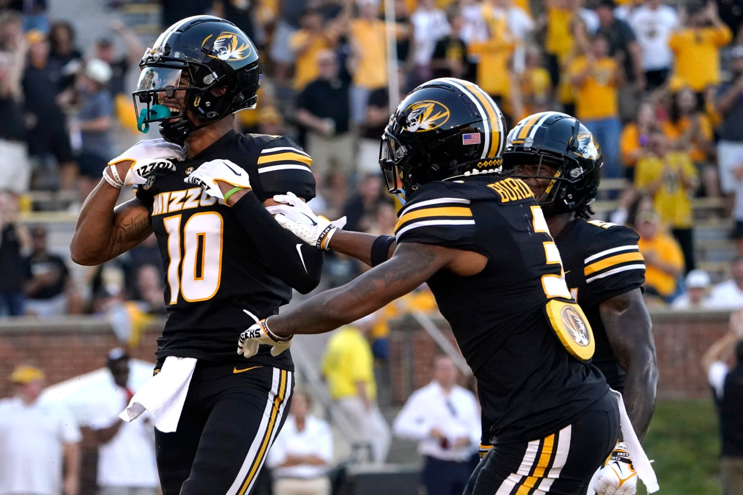 COLUMBIA, MISSOURI - AUGUST 31: Wide receiver Mekhi Miller #10 of the Missouri Tigers celebrates a touchdown reception with wide receiver Luther Burden III #3 against the South Dakota Coyotes in the first half at Faurot Field/Memorial Stadium on August 31, 2023 in Columbia, Missouri. (Photo by Ed Zurga/Getty Images)