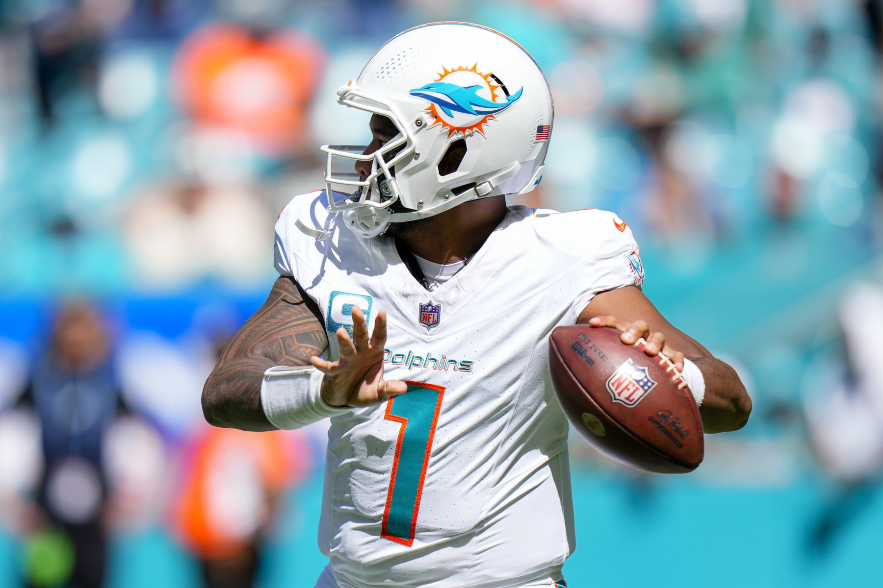 MIAMI GARDENS, FLORIDA - OCTOBER 15: Tua Tagovailoa #1 of the Miami Dolphins looks to throw the football against the Carolina Panthers during the first half at Hard Rock Stadium on October 15, 2023 in Miami Gardens, Florida. (Photo by Rich Storry/Getty Images)
