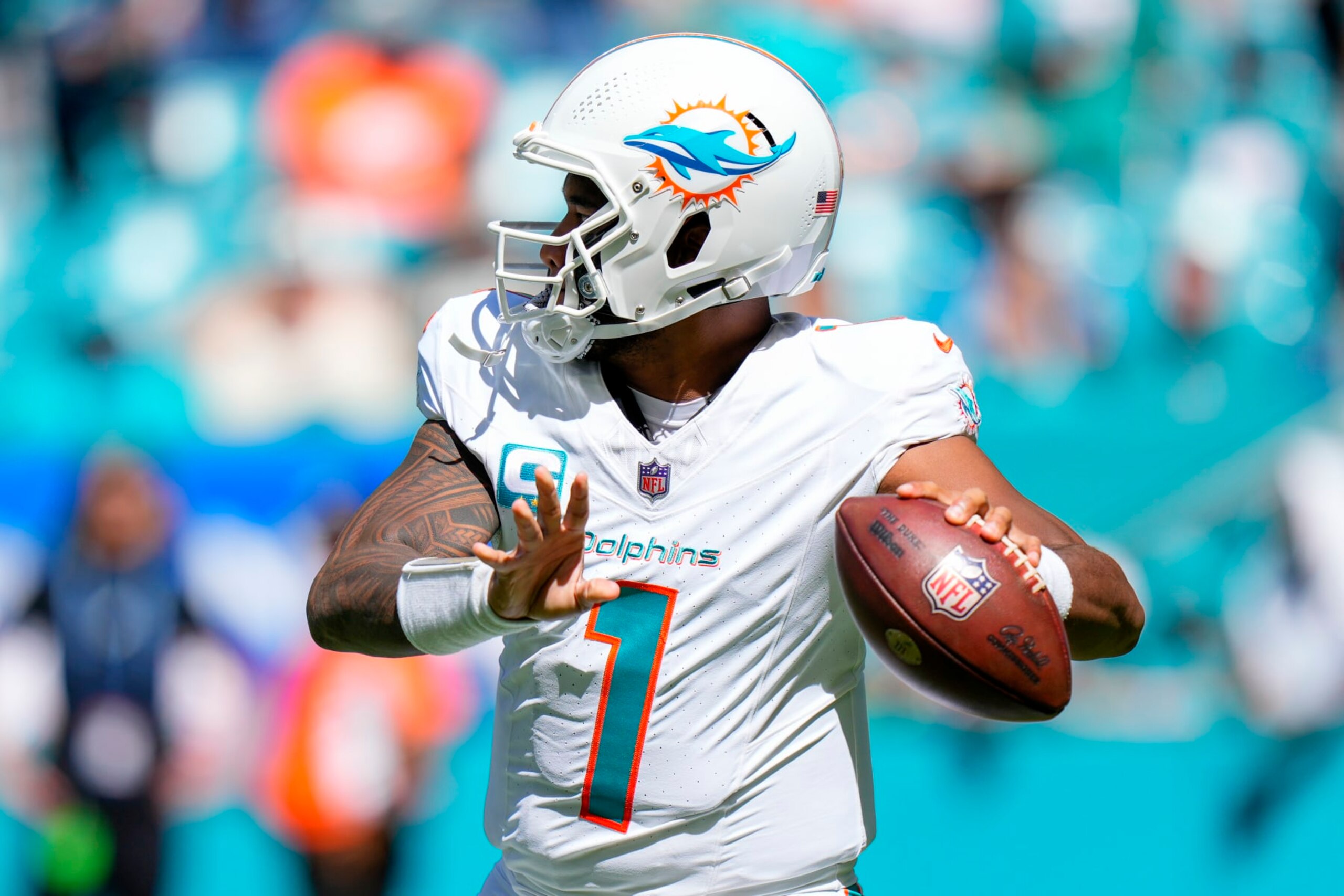 MIAMI GARDENS, FLORIDA - OCTOBER 15: Tua Tagovailoa #1 of the Miami Dolphins looks to throw the football against the Carolina Panthers during the first half at Hard Rock Stadium on October 15, 2023 in Miami Gardens, Florida. (Photo by Rich Storry/Getty Images)