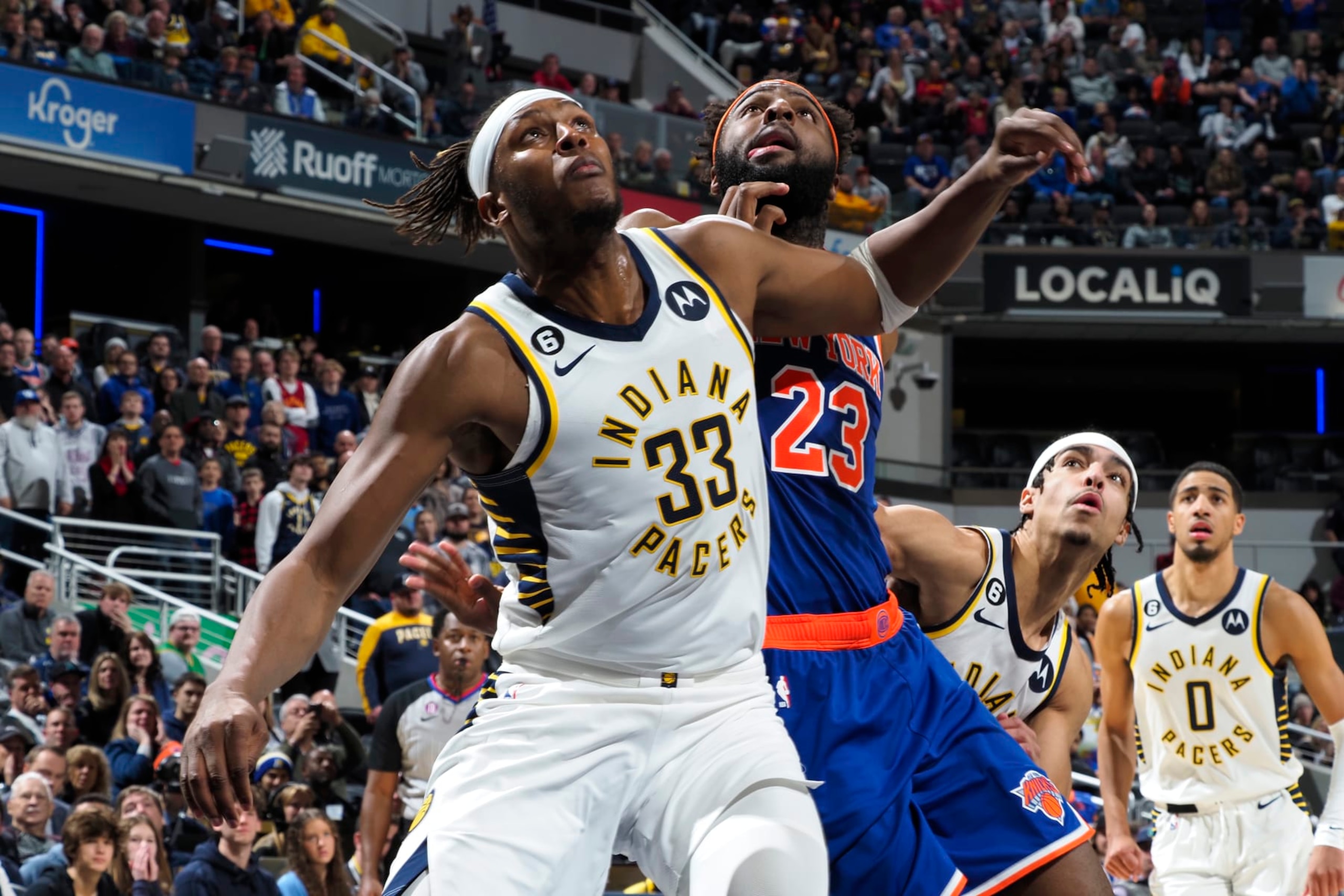 INDIANAPOLIS, IN - DECEMBER 18: Myles Turner #33 of the Indiana Pacers plays defense on Mitchell Robinson #23 of the New York Knicks during the game on December 18, 2022 at Gainbridge Fieldhouse in Indianapolis, Indiana. NOTE TO USER: User expressly acknowledges and agrees that, by downloading and or using this Photograph, user is consenting to the terms and conditions of the Getty Images License Agreement. Mandatory Copyright Notice: Copyright 2022 NBAE (Photo by Ron Hoskins/NBAE via Getty Images) INDIANAPOLIS, IN - DECEMBER 18: Myles Turner #33 of the Indiana Pacers plays defense on Mitchell Robinson #23 of the New York Knicks during the game on December 18, 2022 at Gainbridge Fieldhouse in Indianapolis, Indiana. NOTE TO USER: User expressly acknowledges and agrees that, by downloading and or using this Photograph, user is consenting to the terms and conditions of the Getty Images License Agreement. Mandatory Copyright Notice: Copyright 2022 NBAE (Photo by Ron Hoskins/NBAE via Getty Images)