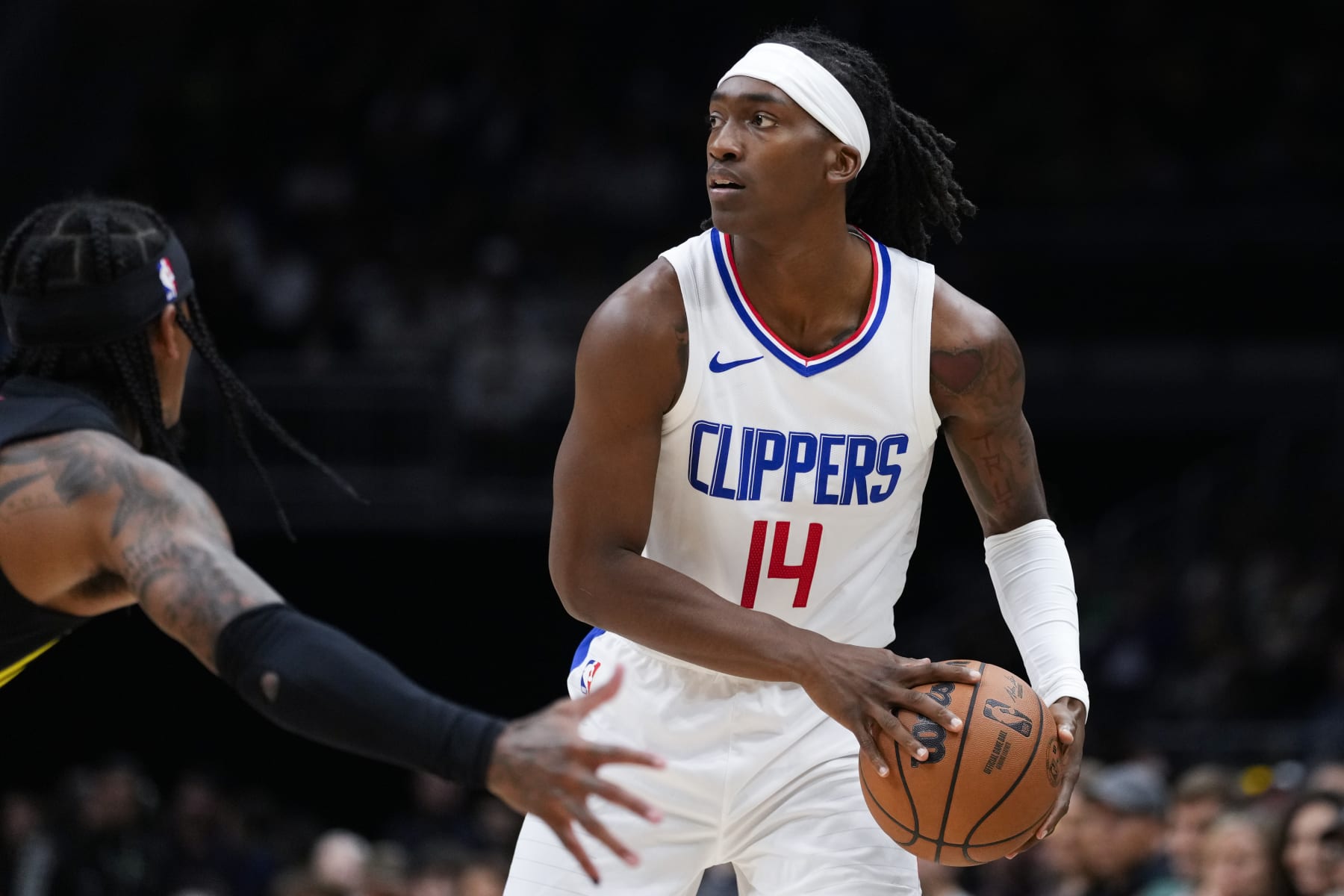 Los Angeles Clippers guard Terance Mann (14) in action during the first half of a preseason NBA basketball game against the Utah Jazz, Tuesday, Oct. 10, 2023, in Seattle. (AP Photo/Lindsey Wasson)