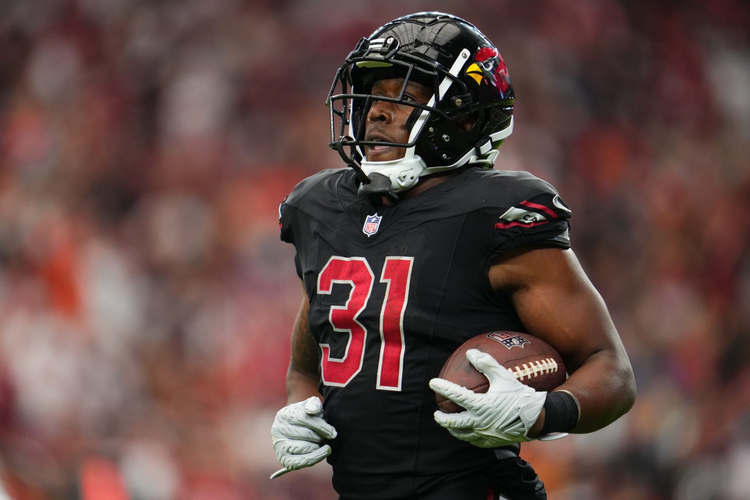 GLENDALE, AZ - OCTOBER 08: Emari Demercado #31 of the Arizona Cardinals celebrates after scoring a touchdown against the Cincinnati Bengals during the second half at State Farm Stadium on October 8, 2023 in Glendale, Arizona. (Photo by Cooper Neill/Getty Images)