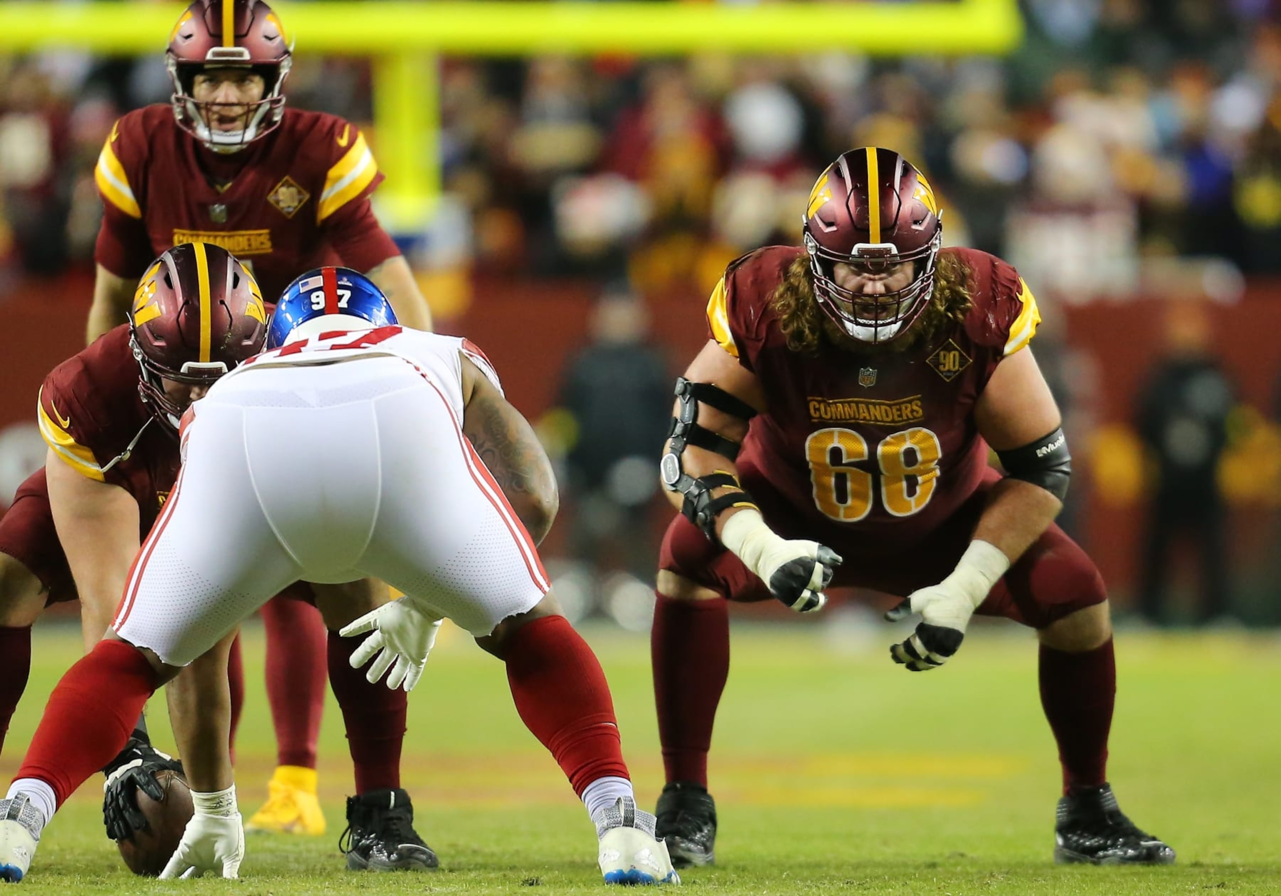 LANDOVER, MD - DECEMBER 18: Washington Commanders center Wes Schweitzer (71) and guard Andrew Norwell (68) prepare to block New York Giants defensive lineman Dexter Lawrence (97) during the New York Giants game versus the Washington Commanders on December 18, 2022, at FedEx Field in Landover, MD. (Photo by Lee Coleman/Icon Sportswire via Getty Images)