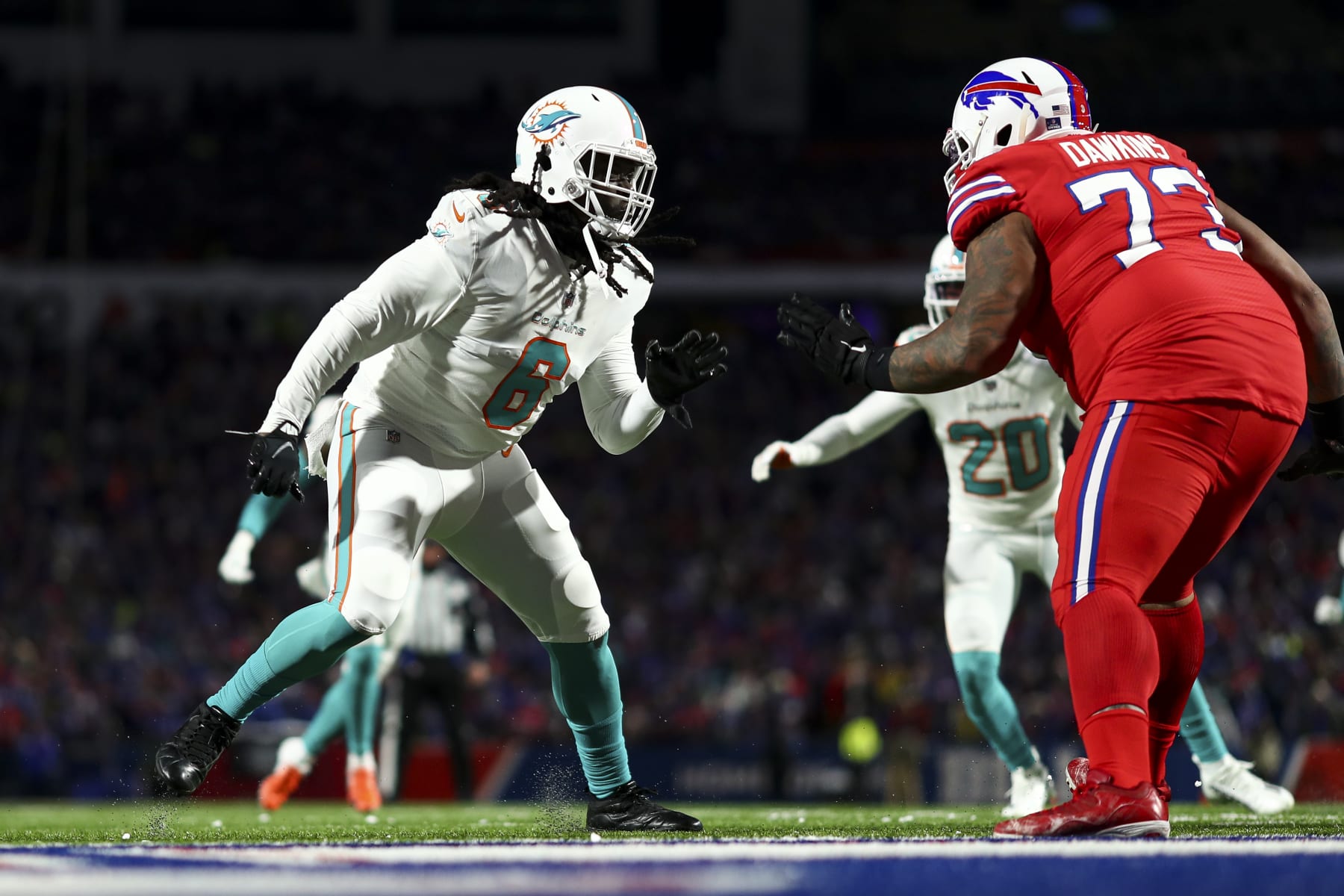 ORCHARD PARK, NY - DECEMBER 17: Melvin Ingram #6 of the Miami Dolphins rushes the quarterback during an NFL football game against the Buffalo Bills at Highmark Stadium on December 17, 2022 in Orchard Park, New York. (Photo by Kevin Sabitus/Getty Images)