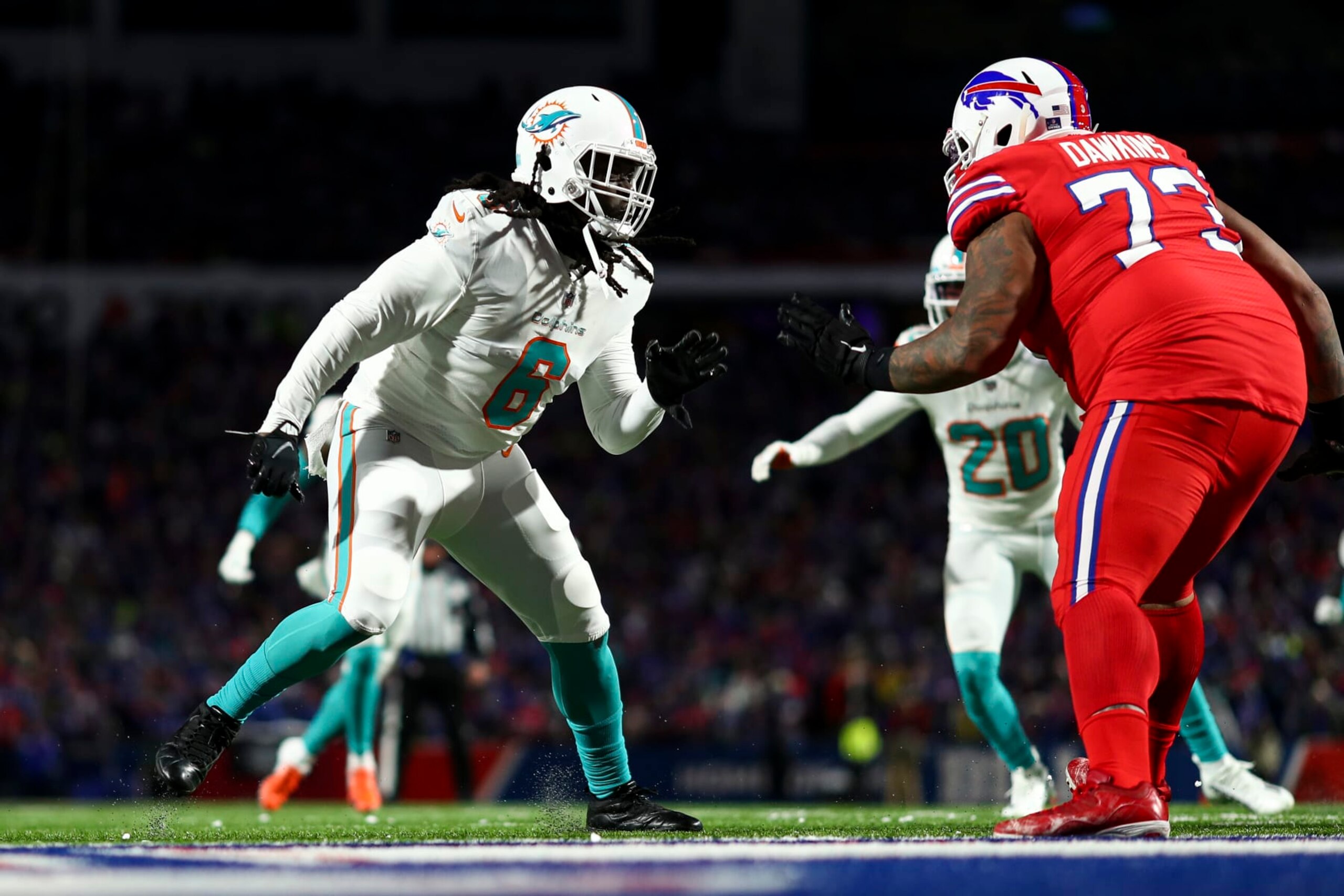 ORCHARD PARK, NY - DECEMBER 17: Melvin Ingram #6 of the Miami Dolphins rushes the quarterback during an NFL football game against the Buffalo Bills at Highmark Stadium on December 17, 2022 in Orchard Park, New York. (Photo by Kevin Sabitus/Getty Images)